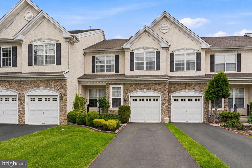 Luxury, location, and convenience all take center stage at 43 Brecknock Ct. Situated in the highly sought-after Wiltshire Walk subdivision in Newtown Township, this exceptional home truly captures it all. As you arrive, you’re welcomed by an expansive driveway, freshly manicured landscaping, and an inviting foyer that immediately sets the tone for the home. Anchored by gleaming hardwood floors, the entryway features 9-foot ceilings, crown molding, wainscoting, and an upgraded lighting package that together create a feeling of openness, charm, and sophistication. The foyer flows seamlessly into a well-appointed dining room, highlighted by a gorgeous chandelier and the perfect ambiance for hosting gatherings both large and small. The heart of the first floor is the dramatic two-story living room, where large windows and a gas fireplace combine to create a bright yet cozy setting for relaxing evenings or entertaining guests. Connected effortlessly to the living space is a beautifully designed kitchen that blends style, functionality, and simplicity. Featuring a large and functional peninsula, breakfast area, new kitchen appliances, and modern finishes throughout, this space was designed with both everyday living and entertaining in mind. Sliding glass doors lead to a newly built, maintenance-free Trex deck and fenced backyard retreat — the ideal setting for summer cookouts, gatherings with friends, or simply enjoying the ease of HOA living. Completing the main level is a thoughtfully positioned powder room and access to a well-designed garage space with built-in storage, as well as a Level 2 EV charger for added convenience. Upstairs, you’ll find three of the home’s four bedrooms, including an impressive primary suite featuring a regal tray ceiling that adds both depth and elegance to the space. The suite also offers dual closets and a luxurious ensuite bathroom complete with double vanity sinks, a glass-enclosed shower, and soaking tub. Two additional bedrooms provide generous space and ample closet storage. The second-floor laundry room is equally impressive in both size and functionality, featuring additional storage and a utility sink. And then comes one of the home’s most exciting features — a dreamy third-floor loft and bedroom space complete with an oversized closet, additional storage, beautiful sky view, and its own dedicated central air and thermostat for personalized comfort. Whether used as a guest suite, home office, playroom, or creative retreat, the possibilities here are endless. The finished basement completes the home in spectacular fashion. Rich stone flooring, elevated finishes, and a thoughtfully designed layout create a space that feels both luxurious and inviting. Enjoy movie nights in the professionally designed 7.2.2 Dolby Atmos home theater system — with wiring and receiver included — entertain effortlessly around the custom bar, and appreciate the added convenience of a rare full bathroom on this level. This home is truly buttoned up from top to bottom with meaningful upgrades that provide both style and peace of mind. Recent improvements include a brand new roof, high-efficiency HVAC system, new hot water heater, whole-house water filtration and softener system, ADT security system, premium ceiling fans, and fresh neutral paint. The location itself offers unmatched convenience — just minutes from I-295 for easy commuting to Philadelphia, Princeton, or New York City, while also being only a short stroll from Historic Newtown Borough and its renowned restaurants, shops, and community atmosphere. In addition to all of this, the owner secured a permanent tax assessment reduction, resulting in annual property taxes estimated to be significantly lower than comparable homes within the neighborhood — creating meaningful long-term savings. All together, 43 Brecknock Ct represents a rare opportunity to own a truly turnkey home in  a great neighborhood.