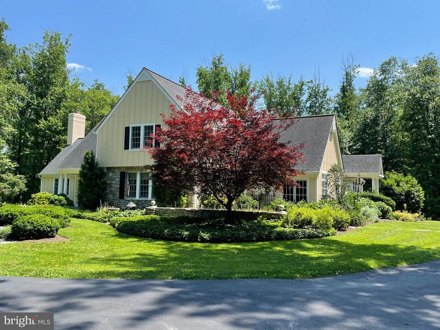 In the lovely & well-located neighborhood of Stevenson in Greenspring Valley, this  expanded cottage-style home (4-5 bedrooms, 4½ baths) is situated on a 4.6 acre partially wooded professionally landscaped lot, with detached 4 car barn-style garage. Enter via the tree-lined lighted driveway with a cobblestone-bordered front court around a center island with multi-stemmed birch tree. Wide stone walkways, fine landscaping, & up-lighting on many trees give a gracious feel to this area. Built in 1982, this home underwent a full renovation in 2008 doubling its size, & incorporated high-end interior, exterior & landscaping materials, a new driveway & walkways and a 3 zone energy saving geothermal HVAC system.  The remaining windows, garage and original baths were more recently renovated. 
    The entrance foyer flows to the living room (with wood burning fireplace & custom cabinetry), dining room (with tray ceiling, gas fireplace & hidden closet housing A/V technology), and a guest bedroom currently used as an office with private bath (jetted tub & separate shower) and large closet. A den/library adjacent to the living room leads to the primary bedroom suite featuring 2 walk-in closets, a make-up area alcove & the primary bath with a double shower & dual sinks set in custom cabinetry. 
   The centrally located kitchen features a large, 2-level center island with limestone countertops, 2 large pantries with French doors, farm sink w/instant hot & vegetable sink each w/disposals, gas 5 burner cooktop, additional 2 drawer refrigerator, dual wall ovens w/convection & warming drawer, 2 dishwashers and microwave. Extensive custom cabinetry is by Rojahn. Beyond is the breakfast room w/inlaid mahogany wood flooring, an adjacent charming bar room w/custom cabinetry, compass rose inlaid in floor, wine refrigerator & cathedral ceiling, each looking out to the ipe deck and backyard. The family room is graced with a tray ceiling, custom cabinetry and open gas fireplace with stone surround & hearth. Nearby is a delightful 400 sq. ft. screened porch w/a soaring ceiling, which also gives access to a 600 sq. ft. ipe deck w/propane hook-up for grilling off the bar area. A double stair leads to the lower level hardscape & backyard. Off the kitchen is a combination pantry/office, laundry room & mudroom w/2 closets leading to the side entrance porch. 
   The upper level has 2 spacious bedrooms (one with custom cabinetry & an attached sleeping room) each with 2 closets and sharing a full bathroom renovated in 2011.  Separate finished and unfinished storage rooms, and a large linen closet provide generous storage. 
   The lower level features 3 large finished rooms (w/closets, ample windows & sunlight), which open to grade level through 3 sets of French doors. Includes a full bathroom (with dual sinks and steam shower), 2 very large unfinished storage rooms, one having a double window & potential as a bedroom or wine room. One closet is pre-constructed for a washer/dryer unit. Area outside the lower level and underneath the deck & screened porch features blue stone bordered cement decking with columns & an attached pergola. There is ample room for a swimming pool off the lower level in the large backyard…a bird lover’s delight w/many species represented. Property backs to a 45 acre parcel providing even more privacy! The detached renovated 4 car barn-style garage had a new roof, garage & entry doors, windows & cupula installed in 2013. 
    All this with Stevenson Village shopping a short walk down the road and Greenspring Station, 695 and I83 within a 5-6 minute drive. Easy commute to BWI airport.
Note: HVAC is an efficient 3 zone geothermal system featuring Water Furnace “Envision” geothermal heat exchange and blower equipment (with humidifier) installed by Total Energy in 2008.  3rd zone is split for more refined temperature control.  A forest conservation easement  exists and is noted on plat.