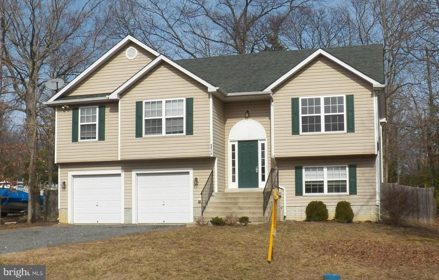 MUCH LARGER THAN IT APPEARS*OVER 2,000 SQUARE FEET OF LIVING SPACE PLUS OVERSIZE 2 CAR ATTACHED GARAGE*VERY OPEN FLOOR PLAN*DECK OFF KITCHEN OVERLOOKING HUGE FENCED BACK YARD*FULLY IMPROVED BASEMENT WIRED FOR SURROUND SOUND AND HAS FULL BATH*FRESHLY PAINTED AND CARPET JUST INSTALLED*VACANT AND READY FOR IMMEDIATE OCCUPANCY*1 YR HOME WARRANTY*COMMUNITY BEACH, TENNIS, GOLF COURSE AND RESTAURANT*