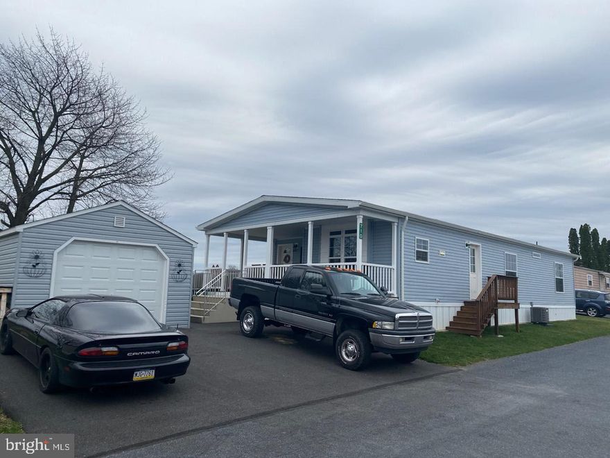 Come check out this beautiful well maintained double wide in Palm city park.   The home was built in 2020 and even comes with a detached garage with matching siding.  Spacious eat in kitchen with a nice sized Island.  Roomy master bedroom also has a full sized bath attached.   Nice covered front porch to sit and enjoy the day.  Views of farm fields along the back of the property.  Must get park approval.    Agent is related to seller. Offer received,  Offer deadline of Tuesday 4/2 at 7pm