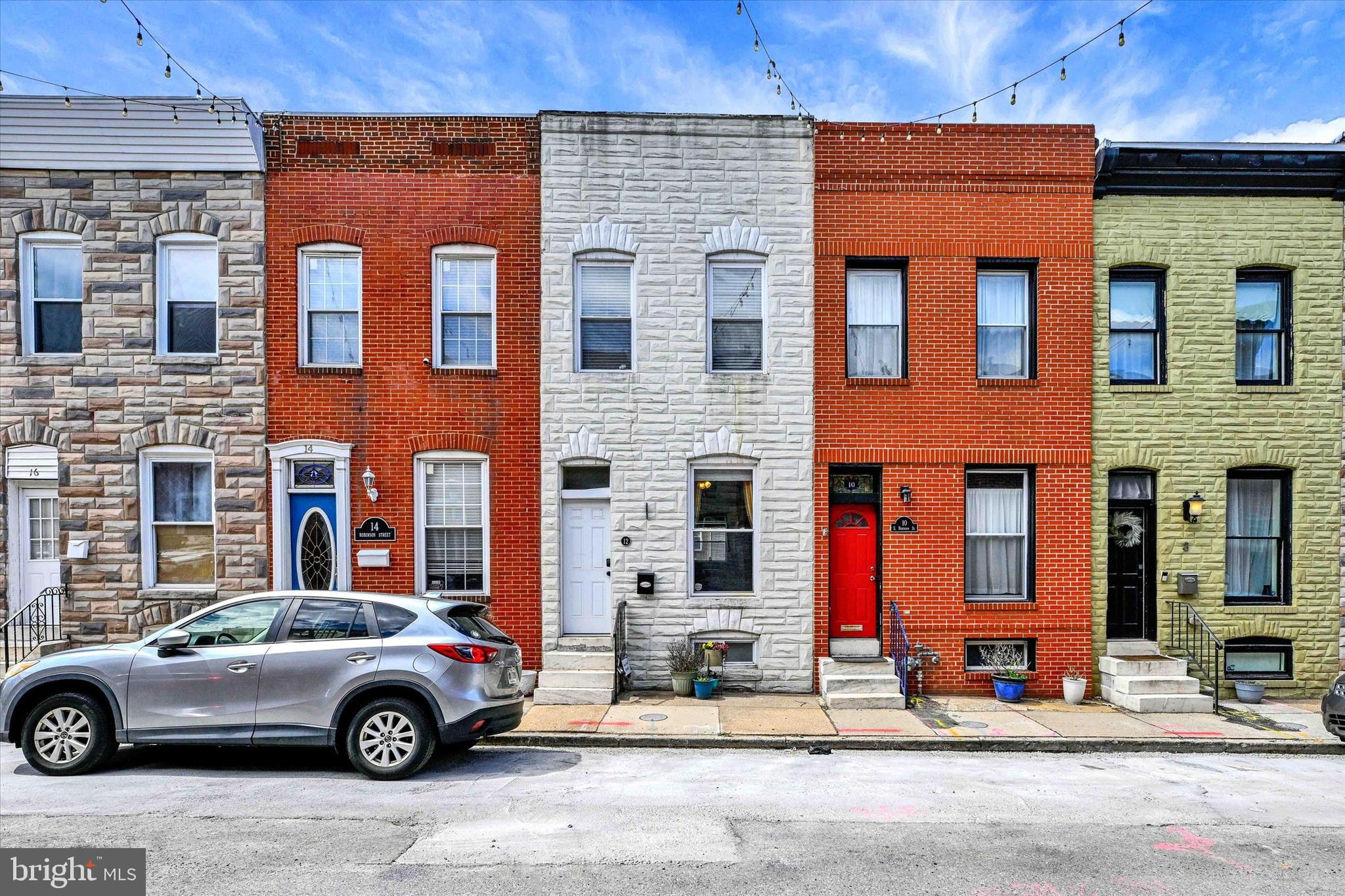 Located just a few blocks from Patterson Park, this rowhome has an open floor plan that creates a bright and spacious living environment. LVP was just installed throughout the first level, the second level carpet was also just replaced. The second level layout includes two bedrooms, along with a versatile den off the primary bedroom—perfect for a home office, nursery, walk-in closet, or additional living space. Plus, a large back patio that offers the potential to easily be converted into a parking pad.