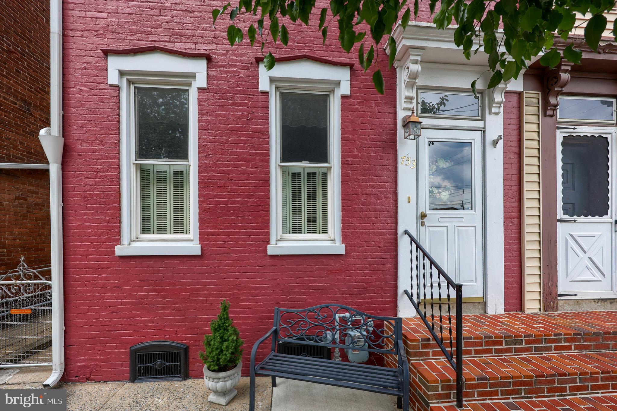 Classic charm awaits you in this beautiful, updated semi in a super convenient location. The first thing you notice is how immaculate this home is. There is great attention to detail from the new wood flooring to the spotless paint. There is ornate woodwork, tall ceilings and loads of classic features. This home boasts cool central air conditioning, economical gas heat, almost new roofing and a cozy wood burning stove in the formal living room. You must see the yard! Whether entertaining an afternoon cook out or relaxing by the solar lighting, you will enjoy hours of relaxation here. Act now before this home is gone!