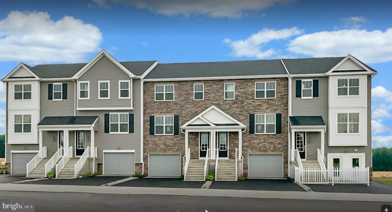 Brand New Townhouse, be the first one to leave in, a new town home community perfectly situated between Downingtown and West Chester, Minutes away from Throndale/Paoli Train station with direct trains Philadelphia downtown. Great shopping, dining and entertainment, close to Rt 30, Rt 322 and best of all located in highly acclaimed Downingtown School District. Enter this 3 story town home where you immediately notice the 9ft ceilings and the elongated foyer. As you walk you will notice a 2 story foyer and powder room to the right with harwood flooring. Take the stairs down to your Rec Room where you can create endless possibilities. Family game night? A movie theater? It's all up to you! Walk out to your backyard where you can create a patio as well! Take the stairs up where you enter the Kitchen and Great room! All Stainless Steel appliances, granite countertops,island and granite bar top which can provide great space for working . Walk out to the deck which is perfect for hosting summer barbecues! As you walk up to your third level you will enter your Master bedroom. This room includes a tray ceiling with LED lights and huge windows for natural light! The master bath has 13x13 tile and a sit down bench in the shower; no more standing up!!! This home also includes 2 more bedrooms with bump outs and a hall bath with more ceramic tile! Lastly, for your convenience, the laundry room is upstairs equipped with washer and dryer. All pictures are of model home and used for representation purposes only.
