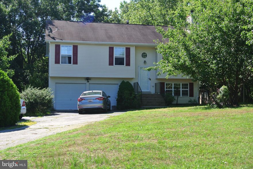 Charming Split Foyer nestled in the woods.  Rear Deck overlooks private back yard.  Great Location for a commute to Pax River.  High Speed internet available from Atlantic Broadband for working from home.  Great Starter home for a growing family.  Eligible for 100% financing thru USDA Rural Development (If Qualified).  Move In Ready. Close to schools and shopping