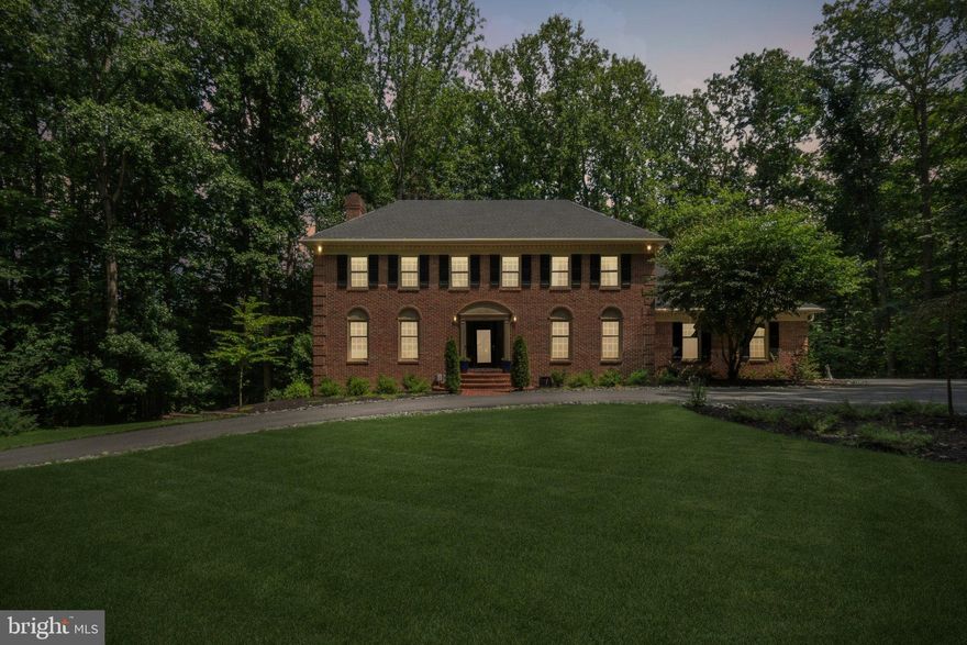 SELLERS OFFERING 10k CREDIT TO THE BUYER FOR CLOSING COSTS OR A BUY DOWN.  The well/septic/termite inspections will be at no cost to the buyer.  Welcome to 5504 W Ridge View Drive, a private sanctuary nestled at the end of a serene half-mile private drive on a picturesque 5-acre wooded lot in the heart of Fairfax. This stately brick-front Colonial has been beautifully updated to offer modern luxury, timeless charm, and every comfort you could wish for. The spacious interior spans over 4,300 finished square feet and features newly refinished hardwood floors, added recessed lighting, and custom built-ins in the cozy family room—creating an inviting atmosphere perfect for both entertaining and everyday living. The gourmet kitchen is a chef’s dream, outfitted with quartz countertops, new cabinetry, a Wolf gas range, and a Subzero refrigerator. Adjacent to the kitchen, the oversized mudroom connects to the large side-load garage and includes a gym area with a built-in weight rack.

Upstairs, the generously sized bedrooms offer abundant space and comfort, including a luxurious primary suite with a fully renovated spa-like bathroom, skylights, and a walk-in closet. The Jack-and-Jill bathroom has also been completely renovated with modern finishes, offering both style and functionality. The walkout lower level features luxury vinyl plank flooring, a spacious recreation room, a bonus room perfect for guests or a home office, and an additional full bath. Step outside to your 40-foot rear deck overlooking the trees and enjoy the peaceful view—or relax in the hot tub, which conveys with the home. Over $40,000 in professional landscaping enhances the property's beauty and curb appeal.

Major system upgrades include a brand new HVAC system (2025), a tankless hot water heater (2024), washer and dryer (2023), and a roof replaced in 2016 with 35-year architectural shingles. Pella front and sliding glass doors, elegant lighting, gas log fireplace, and thoughtful touches throughout make this home truly move-in ready. Located in the highly sought-after Woodson High School pyramid, this one-of-a-kind property offers the rare combination of privacy, luxury, and location.