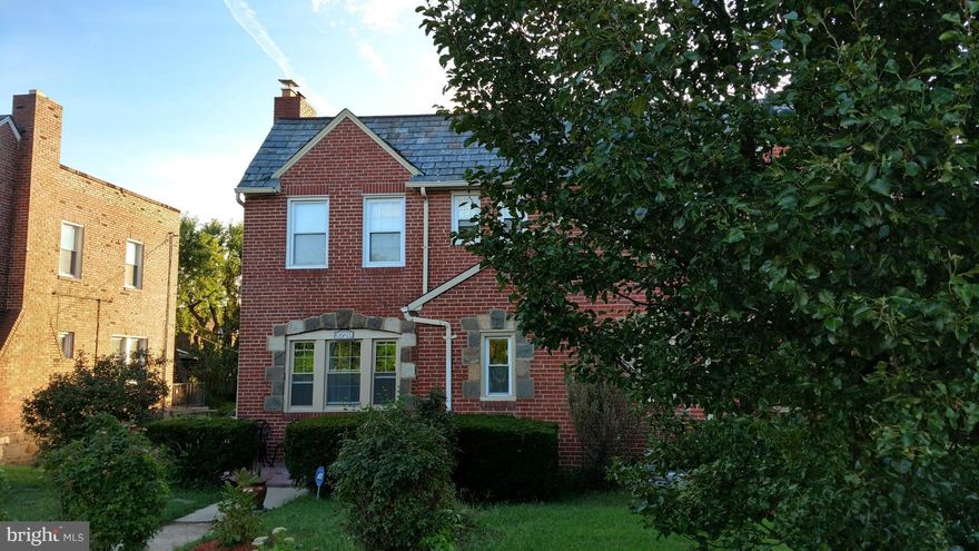 Back on the market! Beautiful stone and brick end-of-group on large lot has a walk-out basement apartment under a 3 bedroom house w/ lots of old-world charm, french doors leading to balcony over attached garage. Driveway holds up to 3 cars. Huge new stainless steel refrigerator & new stove. Well maintained exterior and beautifully landscaped yards.