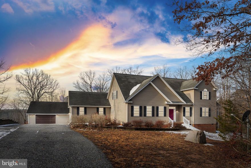 Welcome home where peaceful country living meets space, comfort, and convenience. Situated on 3 private acres, this beautifully maintained home offers 3,650 total square feet spread across two spacious levels, giving you all the room you need to live, gather, and grow. The main level is thoughtfully designed for everyday living and entertaining. The family room features a cozy gas fireplace, while the spacious eat-in kitchen shines with stainless steel appliances (all new in 2020), granite countertops, tile backsplash, and updated flooring (6 years ago). Just off the kitchen, you’ll find a separate formal dining room accented with chair rail and crown molding making it perfect for hosting holidays and special occasions. The primary suite is conveniently located on the main level and offers two walk-in closets and a beautifully renovated ensuite bath (updated 7 years ago) complete with a tiled walk-in shower with bench, double vanity, and tile flooring. Two additional bedrooms, a full bath, mudroom, and half bath complete the main level. Upstairs, the possibilities are endless. This massive second level includes a large second family room, recreation area, full bath, and two additional rooms ready to be finished into ideal bedrooms, offices, or hobby spaces. You’ll also appreciate the abundance of storage throughout. Outside, enjoy the private setting from your large composite back deck overlooking the fenced rear yard. Car enthusiasts, hobbyists, or those needing extra space will love the 2-car attached garage plus the oversized 2.5-car detached garage. Additional features include a Generac generator, encapsulated conditioned crawlspace, septic pumped January 2025, and a new pressure tank (2024). High-speed Fiber Firefly internet is available, making remote work or streaming a breeze. All of this in a fantastic location just minutes to I-64 and close to the town of Louisa. If you’ve been dreaming of space, privacy, and a well-built home with room to expand, this is it!