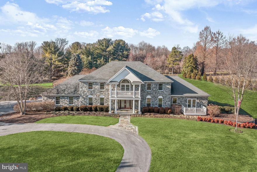 Extraordinary custom estate, all stone exterior, nestled on 3.45 sprawling acres in the desirable Oakwood Overlook community. Originally constructed in 1988 by Hallmark Builders, this residence underwent a comprehensive quality transformation in 2010, introducing modern elegance and functionality. The addition of a lower-level bedroom, full bath, powder room, and laundry room/mud room enhances the home's livability. Kohler plumbing products grace most of the home, ensuring quality and durability. The property boasts four Navien tankless water heaters and a variable frequency drive well pump for efficient living. Natural light graces every room through Andersen windows, while Hunter Douglas shades add a touch of sophistication. The kitchen, a culinary haven, features Wolf appliances, including a 48” gas range top, double oven, and hood. Subzero appliances, a Meile steamer, and a KitchenAid microwave complete the gourmet experience. Notable additions such as a Sub-Zero drawer refrigerator and freezer, pull-out spice cabinetry, motorized shades over the sink, and a built-in warming drawer showcase thoughtful design. The great room exudes warmth with built-in cabinetry, a two-sided gas fireplace, and a custom mantle. The stunning family room addition offers additional comfort with a coffered ceiling, two-sided gas fireplace, custom built-ins, a wet bar, a KitchenAid beverage cooler, motorized shades, and another custom mantle. A 1st floor ensuite bedroom with a private balcony provides the perfect space for visiting guests. Entertain in the formal living and doing rooms graced with plenty of natural light. A powder room and a custom arrival center conclude the magnificent main level. Travel upstairs to the expansive primary suite complemented by one sizable walk-in closet, a ceiling fan, and crown molding. The gorgeous primary bath epitomizes luxury with dual vanities, a Kohler steam shower featuring 10 body sprays, a hand spray showerhead, digital controls, a stereo, and a Kohler hydrotherapy soaking bath. Convenience is paramount with a towel warming drawer and outlets within the cabinetry. Functional spaces abound, including a 2nd-floor laundry room with a Meile drying cabinet, GE washer and dryer, and a sink. Three additional graciously sized bedrooms with walk-in closets, ceiling fans, en suite bath, and a dual entry bath further add to the opulence. An inviting balcony is the ideal place to enjoy the sunset.  The lower level offers a divine theater room that boasts a 75” TV, six-person stadium seating, a wet bar, a KitchenAid beverage cooler, custom cabinetry, shelving, and theater lighting. A hobby or sewing room features custom storage and a workstation. A large recreation room is a haven, featuring custom-built cabinetry, a large counter bar area, an Asko dishwasher, a KitchenAid under-counter refrigerator, an under-counter beverage cooler, and an ice maker. An additional bedroom, optional In-Law suite or Au Pair suite with a walk-in custom closet and dual entry bath. A laundry room with a GE washer and dryer, and a spacious countertop area with lower and upper cabinetry further enhance the functionality. Step outside to an entertainer’s dream enhanced with a heated in-ground pool with three Mosaic turtles in the bottom, and a newly refinished pool house, complete with a bath and shower. An under-counter KitchenAid refrigerator, cabinetry for entertaining, outdoor Wi-Fi, speakers, a 65” wall-mounted TV, a large ceiling fan, and an LG split system for heating and cooling. Garage door-side access leads to the enclosed pool pump equipment and space for a tractor. The outdoor area is simply an oasis with new fencing around the pool, hardscape, deck, patio, firepit with a gas line, and beautifully landscaped gardens. A backyard fenced-in vegetable garden with a water supply and numerous trees planted in the past four years complete this remarkable property, offering a perfect blend of luxury, and resort-style living!