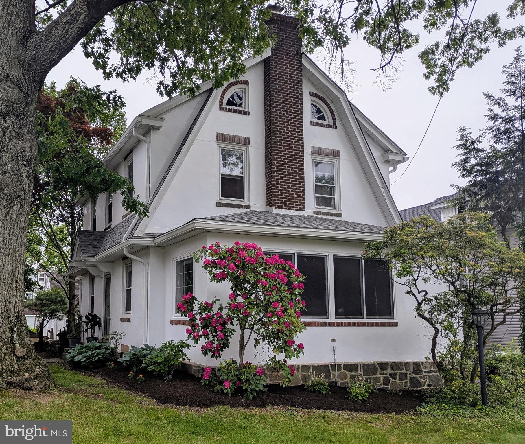 Welcome to 101 Harding Ave, a beautifully maintained Dutch Colonial tucked away in the heart of Hatboro, just a short walk from all the dining, shops, and small-town charm of Main Street. You are just blocks away from a town brimming with craft breweries, car shows, first Friday events and many parades.
This 3-bedroom, 2 bath home blends classic character with thoughtful updates. You’ll love the stunning architectural details—arched windows, custom brick accents, and a timeless stucco exterior that gives this home unforgettable curb appeal. This home also has 550+ sq ft of unfinished attic that could be turned into whatever you dream!
Inside, natural light pours through large windows, highlighting the spacious layout and cozy vibe. The enclosed front sunroom is perfect for morning coffee or a quiet reading nook.
But the real surprise? The backyard oasis—a private horticultural retreat bursting with established landscaping, flowering shrubs, and mature trees. It’s like having your own botanical garden, right in your backyard.
Plus, you’ll love the oversized 2-car garage with ample storage space—perfect for hobbies, bikes, or your next workshop project.