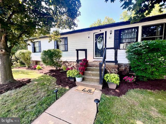 This cozy home is situated in a cul-de-sac and features a spacious 2 car garage with ample wall and ceiling storage and a 2nd exit door on the rear for easy mowing access. Walk into an open concept dining room and newly renovated kitchen including oven, microwave, dishwasher and extra-large island perfect for hosting! Kitchen also features a Coffee Bar corner and an entryway to the deck that wraps around the home to the dining room sliding door. There is even more room below on the open patio area that has a beautiful view of Conewago Creek! The backyard portion of this home has been set up to be self-sustainable, featuring a full vegetable garden, fruit trees and a large chicken coop with run and nest box.
The guest bathroom has been newly renovated with a tiled bath and shower, toilet, vanity, flooring, lighting and plumbing. 2 medium bedrooms upstairs with large, lit closet space in both. Perfect for children. The owner's suite features a warm, wooden statement wall and double windows that
give perfect access to the calming sounds of the creek. Bedroom closet has many shelves with access to the attic through the closet ceiling. The ensuite bathroom inside has a walk-in shower, toilet and large vanity. The living room area includes a beautiful stone wall with available hookup to chimney for a fireplace, and a “Library” area housing many bookshelves, cabinets, drawers and separate lighting making it a perfect area to cozy up with a book! 4th Bedroom downstairs is another owner's suite, carpeted with plenty of open space and small closet. This leads to an office area that can also be used as another living
space, playroom or even a mudroom as it has an entryway leading directly to the driveway and garage.
The laundry room has a toilet, sink, tons of shelving and a cabinet area with top perfect for folding laundry. Also comes with brand new dryer purchased in 2025! A brand-new sump pump with built in de-humidifier and backup battery generator installed in 2024 comes with a lifetime of home warranty. The roof was replaced in 2019. Brand new Hot Water heater installed in 2020. Make this modern home with a beautiful “country” setting yours!