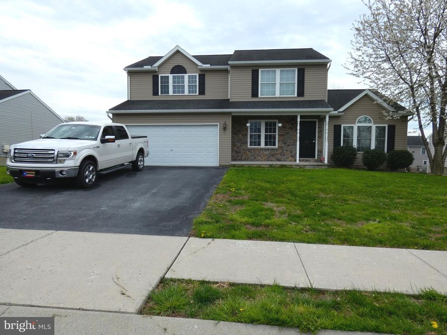 This 2-story home has 1830 sqft., 3 bedrooms and 2.5 baths, a large living room with vaulted ceilings, an open kitchen with breakfast counter. The laundry and half bath are on the first floor.   All 3 bedrooms are located on the 2nd floor. The master suite has a 7x6 walk in closet- full bath with a double sink and a walk-in shower. Lighting and ceiling fans throughout the home have been upgraded. The large 2 story deck with Trellis and storage area. The oversized finished 2 car garage has an extra 11 x 8 work area. The lower level has a finished room and closet. Rough-in plumbing in the basement for bathroom with room for linen closet and storage area. The walkout basement leads to the deck. 19x10 Shed has electric. Fenced yard. Natural gas heat and Central Air.