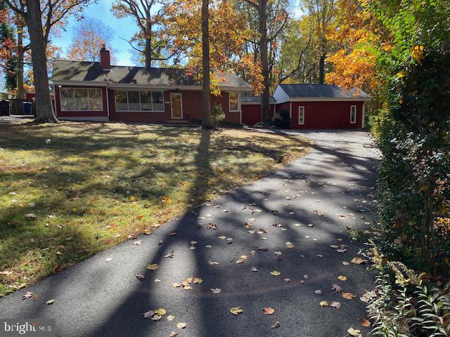 Over 1/2 acre lot. Secluded, Backs to woods, Fully Updated 1 level Fully Brick. Beautiful Country Kitchen w Custom Cabinetry, Granite Countertops, Stainless Steele Sink, Room for Kitchen Table, Ceramic Tile Flooring. Exits to Finished Utility Room and Fully Fenced Rear yard. Addl back yard unfenced. Living room has Hardwood floors, Wood burning Fireplace, Crown Molding, Large Windows w custom 2 way vertical honeycomb Blinds  in LR, Kitchen, Den, Solarium and Owners Suite. Cedar Lined Closets. Custom Windows Throughout.  2 Bedrooms & Family room  BRAND NEW with new carpet! Full Bath includes Jacuzzi.  Entertainment area and rear exit off  2 bedrooms., Solarium, recessed lights with Large windows to preview addl back yard space. 8 x 12 Shed hard wired 110 volt. Small Pond. HW Video Monitor Sys. Fios installed hook up front and rear of Dwelling. Seller subsidy w full price offer for 2nd full bath 8K with full price offer.
Must see and enjoy the secluded quiet end of street with woods that back to Stoney Brooke wooded area.