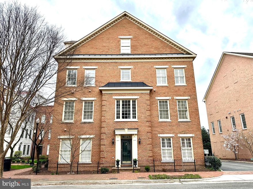 Enter through a private double foyer leading to an en-suite bedroom and bathroom, and to the spacious two-car garage with Elfa storage system and an additional refrigerator. The main level is configured with an open concept living and dining spaces. This level impresses with its architectural details, high ceilings, crown molding, chair railing, a column creating an unobtrusive living-dining delimitation, a living area adorned with custom built-ins by the cozy gas fireplace, and a powder room for convenience. The beautiful hardwood floors are complemented by abundant natural light pouring in from the three exposures. The chef's kitchen boasts black stainless steel appliances, granite countertops, and plentiful storage. Upstairs, the primary en-suite bedroom is generously sized with double walk-in closets and a spa-like bathroom featuring a soaking tub and a separate shower. Another en-suite bedroom and a conveniently located laundry room with Elfa shelving system for all your storage needs complete this level.
On the top level, the fourth bedroom showcases lofted ceilings, while the spacious landing offers a flexible space that can be configured in many ways, such as a home office, family room, or a playroom leading to a private terrace with stunning views of the community.
This home is perfectly located between the clubhouse and the new Potomac Yard Metro Station, adjacent to a beautifully landscaped courtyard. It has been freshly painted and new carpet installed throughout. 
Potomac Greens provides a peaceful retreat with easy access to Old Town, Del Ray, and Washington DC, including Reagan National Airport. Enjoy nearby trails and neighborhood gems like Buzz Bakery and Slaters Market.
Residents benefit from a well-appointed clubhouse with a fitness center with cardio and weight equipment, a outdoor pool, a party/meeting room, green spaces, a nature trail, and tot lots. Don't miss the opportunity to experience this exceptional home and the convenience of living in Potomac Greens!
Disclosures: Agent Related to Owner, Owner RE Licensee