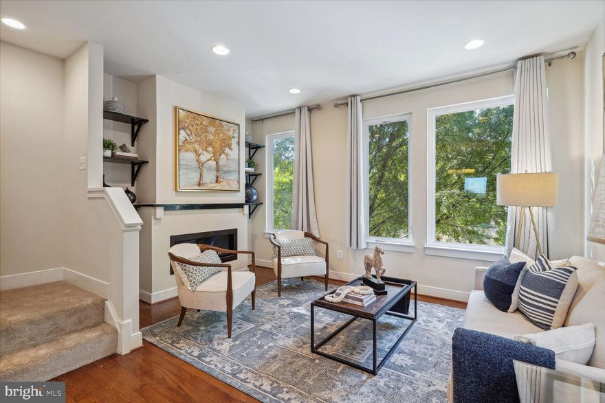 Welcome to the sought-after Arts District Hyattsville! Conveniently located in the heart of the Arts District, this lovely townhouse is close to everything you need on a daily basis! From gourmet grocery shopping at Whole Foods and YES! Organic Market, to hip and trendy restaurants like Busboys and Poets and Franklins, the locally famous Vigilante Coffee, and countless new boutiques, breweries and galleries, this community provides your lifestyle right at your fingertips. And it’s just a short stroll down the Trolley Trail to more wonderful restaurants and breweries as well as the Town Center Market at Riverdale. And all of this is in addition to being just about a mile to West Hyattsville METRO station, a half mile to the Riverdale MARC station, and just 6 miles to downtown DC! High, Wide and Plentiful! As you enter this 4 level EYA developed Bristol model townhome, you are greeted by a first floor home office/den, with lovely stained wood and built-in shelving and desk. In the back is a spacious one car garage. Flooded with sunlight, the second floor of this immaculate home features a large open gourmet kitchen with breakfast bar peninsula, upgraded countertops and stainless steel appliances, plenty of kitchen cabinets and storage, a dining room, a beautifully appointed living room with huge windows and a gas fireplace and built-in shelving! There is also a balcony off the kitchen and a powder room completes the 2nd level. The 3rd level features two bedrooms, including one with a double sink vanity and separate tub and shower, and the other also with an en-suite full bath, and the top level features a full primary suite with another living room, bedroom and private bath. The top level also features the full size washer/dryer and an absolutely lovely private roof deck, perfect for morning coffee or evening sunsets! All freshly painted and with brand new carpeting on the 3rd and 4th levels! With everything you need within these four levels, your dream home is within your grasp! Make your appointment today!