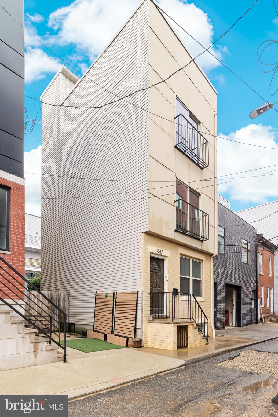 Welcome to this stunning home nestled in the heart of Francisville, just a stone’s throw from Fairmount! This modern, move-in ready residence has been freshly painted and awaits its next proud owner.
Step inside to an inviting open-concept kitchen and living area, perfect for entertaining. The custom kitchen boasts warm-toned cabinetry, gleaming granite countertops, stainless steel appliances, and a sparkling backsplash that ties it all together beautifully. Upstairs, rich hardwood floors flow throughout each bedroom. The first bedroom features a Juliet balcony through a glass door and convenient access to a full hall bathroom, complete with a tub/shower combo and a sleek single vanity. The spacious primary suite offers a second Juliet balcony, ample closet space, and an en-suite bathroom with a luxurious multi-function shower system designed for the ultimate relaxation. Head up to the private rooftop oasis—ideal for hosting or unwinding with a cocktail while enjoying panoramic city views. The finished lower level provides even more living space, a storage area, a convenient half bath for guests, and a stackable washer and dryer. Located in a rapidly developing neighborhood with easy access to public transit and major routes, this home is the perfect combination of style, comfort, and location. Don’t miss your chance to call this gem your own!