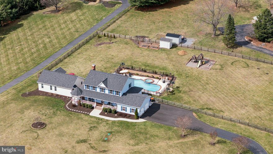 Welcome to your dream home in the highly sought-after Hope Valley Hills Community of Adamstown! This exquisite 5,500+ square foot home has been completely remodeled to perfection, offering modern luxury while embracing the charm of its surroundings. Nestled on a sprawling 1.5-acre lot, this property showcases breathtaking views of Sugarloaf Mountain, providing a picturesque backdrop for your daily life. As you approach the home, you’ll be greeted by a stunning wrap-around front porch, ideal for sipping your morning coffee or enjoying evening sunsets. Step inside the main house to discover an expansive and thoughtfully designed interior featuring high-end finishes and abundant natural light throughout. The main level features an elegant formal dining room, alongside a large living room that invites relaxation and conversation. The upgraded eat-in kitchen seamlessly opens to the spacious family room, complete with a cozy fireplace and glass doors leading to your outdoor swimming pool oasis. The bedroom level in the main house is centered around a luxurious owner's suite, complete with a spacious spa bathroom and a large walk-in closet, providing a perfect retreat. There are three additional well-appointed bedrooms and a stylish shared bathroom on this level. The basement offers a spacious rec room, perfect for entertaining or relaxing, as well as two bonus rooms that can serve as a home office, get room, gym, or playroom. Adding to the charm of this property is a brand-new 2-bedroom guest house perfectly designed for visitors or extended family and offering a comfortable and private retreat with its own family room, full bathroom, full kitchen and a separate deck. This space provides a welcoming atmosphere that ensures guests feel at home while maintaining their independence. Outside will feel like a private retreat with a hardscape patio that overlooks a beautifully landscaped yard, a playground area, and a sparkling swimming pool with a pool deck tiki bar, providing a refreshing escape on warm days. Located just half a mile from Worthington Manor Golf Course and a short distance to the Villages of Urbana, this home combines luxury living with a vibrant lifestyle. New Roof (2024), New Hot Water Heater (2023), New Water Pressure System (2023), Guest House Addition (2023), New Septic Tank (2023), Assumable VA Loan and Urbana High School, Middle and ES. Don’t miss the opportunity to own this exceptional property in a community that truly has it all!