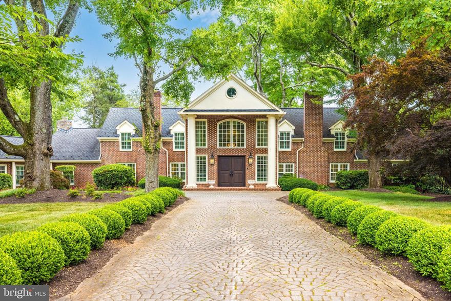 Welcome to 937 Bellview Road – A stunning renovation where historic seamlessly blends with a new look in this home that feels like a country estate in McLean, VA
This handsome stone and brick colonial is located on a sprawling 1.5 acres with circular drive tucked privately off Bellview Road . This exquisite home was completely renovated in 2020 using the finest in materials with high end finishes throughout  making it the perfect retreat for those seeking traditional elegance and convenience to DC, Tysons, The Tech Corridor and Reagan and Dulles International Airports. 

Handsome entrance with a stone promenade lined with boxwoods leading you into the gracious  foyer with an abundance of sunlight a stunning dual staircases punctuated by a European crystal chandelier 

The home boast approximately 8100 square feet of finished living with large entertainment spaces that flow from inside to outside and charming nooks and crannies for cozy family time and reading nooks.   

The bright and light living room features gorgeous chair rail, wainscotting and a fireplace with elegant light fixtures. The airy and gracious dining room has two sets of French doors and another beautiful fireplace and a showcase Visual Comfort chandelier. 

The main level owners suite features a lovely sitting area with gas fireplace, plantation shutters, custom designed closets and a luxury bath with striking soaking tub, marble clad shower, bespoke custom vanities, marble countertops and designer lighting.  

The classic designer kitchen features gorgeous custom cabinetry, tongue and groove ceiling, a center island with globe pendants and marble countertop. The highlight is the cozy breakfast nook flanked by glass front hutches with lovely window and beautiful vistas of the expansive backyard. 

Adjacent to the kitchen, the family room offers a gas fireplace creating a warm and inviting space for family activities. 

The library envelopes you in handsome wood paneling and enhanced with a gas fireplace flanked by custom built-ins offering a cozy work space or private retreat. 

The guest bedroom with en-suite stylish bath is privately tucked away on the main level and has with French doors to the backyard. The light filled sunroom is right off the pool area and can be used as part of your outdoor entertaining. 

The main level is complete with a three car garage with a parking pad for a fourth car and the circular drive was designed to allow for enough space parking a large number of cars for large soirees. 

On the upper level there are three sizable en-suite bedrooms, as well as a spacious second family room . 

A basement was also refinished as a wine cellar and includes storage and utility rooms. 

Situated on a 1.55-acre lot (67,369 square feet), this estate boasts brick and stone construction with a shake roof. The attached garage offers three parking spaces, and additional off-street parking is available. 

Interior details include beamed ceilings, cathedral ceilings, paneled walls, built-ins, a butler's pantry, chair railings, crown moldings and wood beams, a curved staircase, a dual staircase,  seven fireplaces, and beautiful hardwood and slate floors. 

Located in one of the highly sought after school pyramids, Spring Hill Elementary, Cooper Middle, and Langley High School serving the area. 

 Enjoy the classic stone and brick accents and perfectly manicured grounds with expansive terraces along the back of the house that to the pool and patio with a gazebo. This estate is a true gem in McLean, offering a serene escape with easy access to major urban centers.