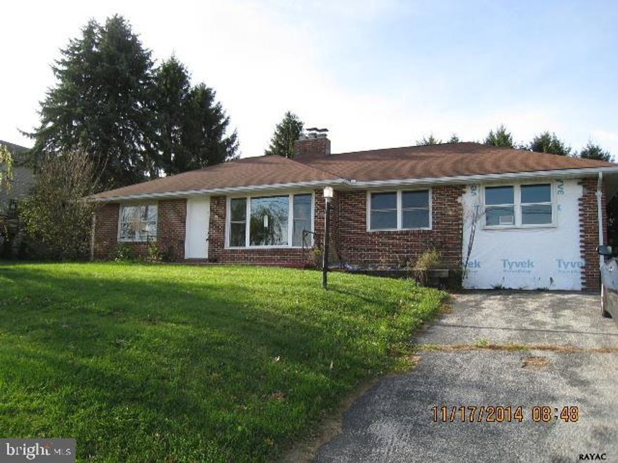 Living room with stone fireplace. Dining area. Hardwood floors. Three bedrooms each with a closet. A bonus room with pull down steps to attic. Off street parking for 5 cars. Level back yard. Shed.