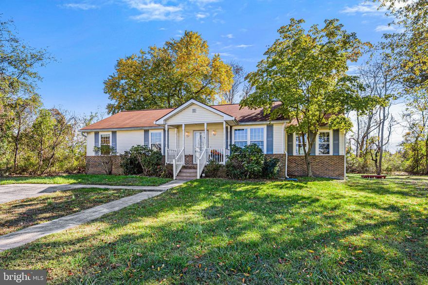 Lovely light filled Rancher in the Poplar Ridge community with a water view.  The spacious kitchen has granite countertops, a skylight, and an island with plenty of space to function as an eat-in kitchen. The beautiful kitchen is bathed in natural light.  There is a gorgeous separate dining room for family gatherings or get-togethers.  The wood burning fireplace in the cozy family room is the perfect place for winter evenings. No carpeting, lovely hardwoods throughout.  The primary bathroom has been completely remodeled with custom ceramic tiled flooring and shower.  Lots of privacy with 2.24 acres of land and a rear deck that is the perfect place for morning coffee.  Freshly painted in 2022, windows were replaced in 2021, roof was replaced in 2016 and the AC/Heat pump was replaced in 2016.  There is a water softener system present.  No HOA.  This is a wonderful place to call home!