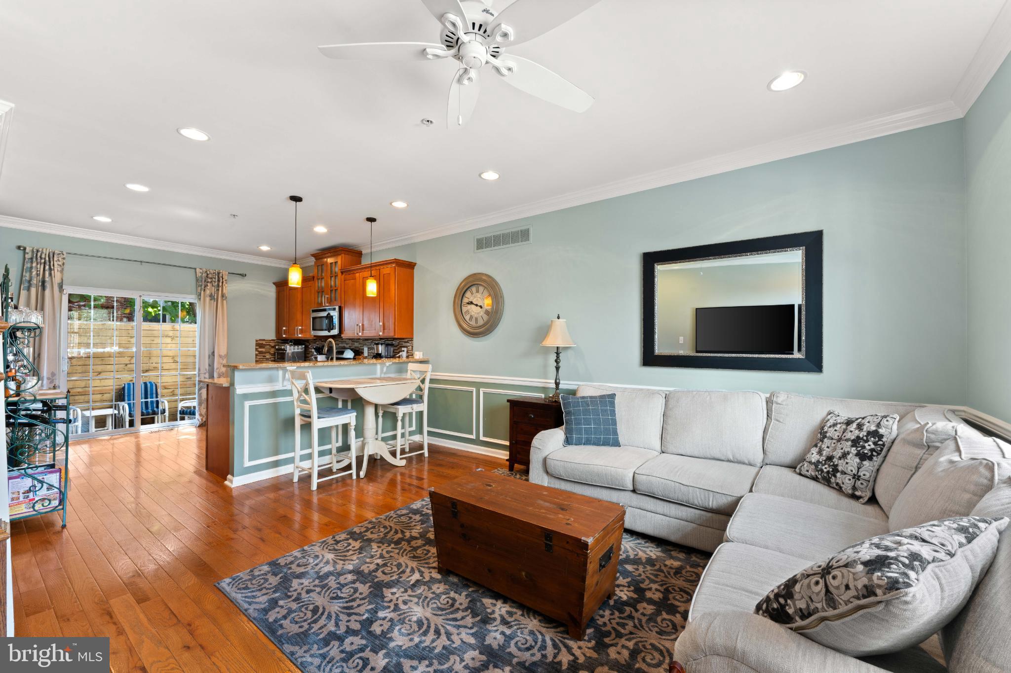 Welcome to 1832 Earp Street, a 2013 build tucked on a quiet block in Point Breeze between 18th and 19th Streets. Freshly painted and move-in ready, this 3-bedroom, 2-bath home features hardwood flooring throughout, an open-concept main level with crown molding, and a beautiful kitchen that flows seamlessly into the dining and living areas. Sliding glass doors open to a private fenced patio, while the finished tiled basement—with washer/dryer, great ceiling height, and a brand new hot water heater (June 2025)—adds versatile living space. The second floor offers two bedrooms and a full bathroom with tub, while the third-floor primary suite impresses with vaulted ceilings, a walk-through closet, and a stunning modern bathroom featuring gold fixtures, clean white finishes, a white oak vanity, and linen storage. Enjoy outdoor living with a balcony off the primary suite that leads up to a roof deck boasting immaculate skyline views, complete with new vinyl siding (2025) and a newer fiberglass roof (2019). All this, just steps from local favorites like American Sardine Bar, Batter & Crumbs, and Dock Street Brewery South.