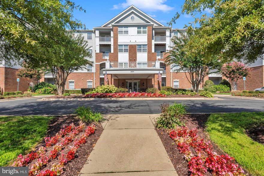 Located in the desirable 55+ community of Waugh Chapel Village, this fine 2 bedroom, 2 full bath condo has a lot to offer! Located on the 3rd Floor, the features include a fully equipped kitchen, dining area, living room with patio door leading to a private balcony,  full size laundry room,  and 2 bedroom suites... each with a private bathroom and walk-in closet! Freshly painted with brand new carpet, kitchen and bathroom flooring, and all new blinds, this really nice condo is sure to please! Also recently replaced are the dishwasher, microwave, dryer, garbage disposal and the HVAC system. The building offers 2 elevators, 2 trash rooms on every floor, a community room for fun activities, PLUS a private exercise room.  Also, for added convenience, there is a secure underground parking space and a personal storage area!  Plenty of outdoor parking available as well!  The lobby and hallways have been tastefully redecorated in the last year. The Village South condos are within walking distance of both the Village at Waugh Chapel and the Waugh Chapel Towne Center, offering numerous dining and shopping choices, 2 major grocery stores, medical and dental services, gyms, pharmacies, banking, and MUCH MORE! Don't miss it! Come see why this is one of the most popular 55+communities in the area.