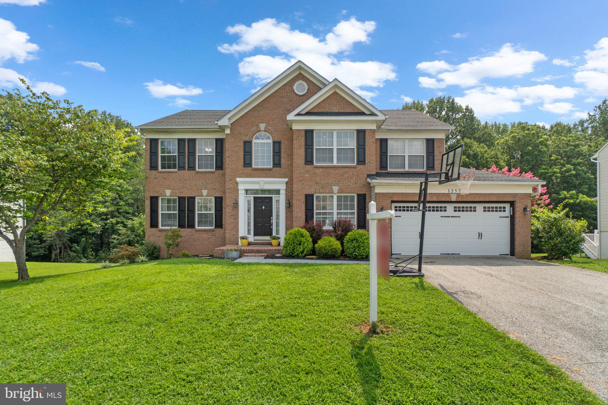 Welcome to this beautifully maintained 5-bedroom home offering space, comfort, and style! The heart of the home is the gorgeous eat-in kitchen featuring granite countertops, a striking tile backsplash, stainless steel appliances including a microwave rangehood, and a peninsula with barstool seating. A charming breakfast nook framed by windows opens to a large bi-level deck—perfect for entertaining or relaxing. The adjacent family room boasts a cozy fireplace, and the main level also includes a formal living and dining room, a convenient half bath, main floor laundry, and a private home office.
Upstairs, you'll find four spacious bedrooms including a luxurious owner's suite with vaulted ceiling, a huge walk-in closet, and a spa-like ensuite bath with double sink vanity, large soaking tub, and separate shower. A full hall bath with double vanity completes the upper level.
The finished walk-out lower level offers a versatile rec room, media space, or home gym, along with a fifth bedroom, full bath, and direct access to the backyard. Enjoy the serene wooded backdrop, an expansive deck, and a 2-car garage. All this just a short drive to shopping and dining—this home truly has it all! Mortgage savings may be available for buyers of this listing.