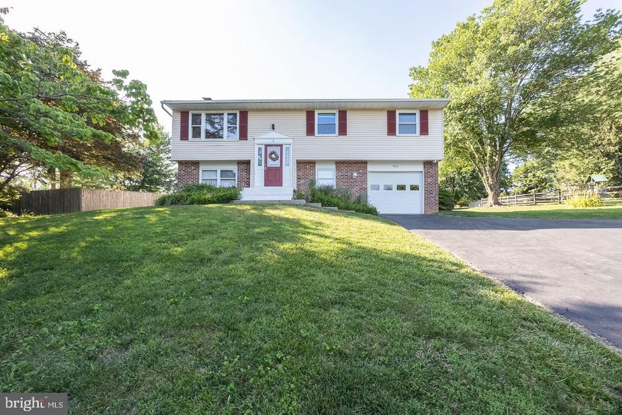 Welcome to 1902 Escourt Drive! This spacious bi-level home offers an open main floor layout perfect for everyday living and entertaining. Featuring 3 bedrooms and 2.5 bathrooms, including a primary bedroom with its own en-suite bath, this home blends comfort with functionality. The freshly updated kitchen boasts black appliances and plenty of cabinet space for storage. Downstairs, you'll find additional living space with a cozy fireplace and walkout doors leading to the large, flat backyard—perfect for gatherings, play, or simply enjoying the outdoors. A newer AC unit and a generator provide peace of mind and year-round comfort. The oversized one-car garage includes extra storage space for tools or hobbies. Enjoy summer evenings on the large wooden deck overlooking mature, low-maintenance landscaping. Conveniently located with easy access to local amenities—this home is ready for you to move right in!