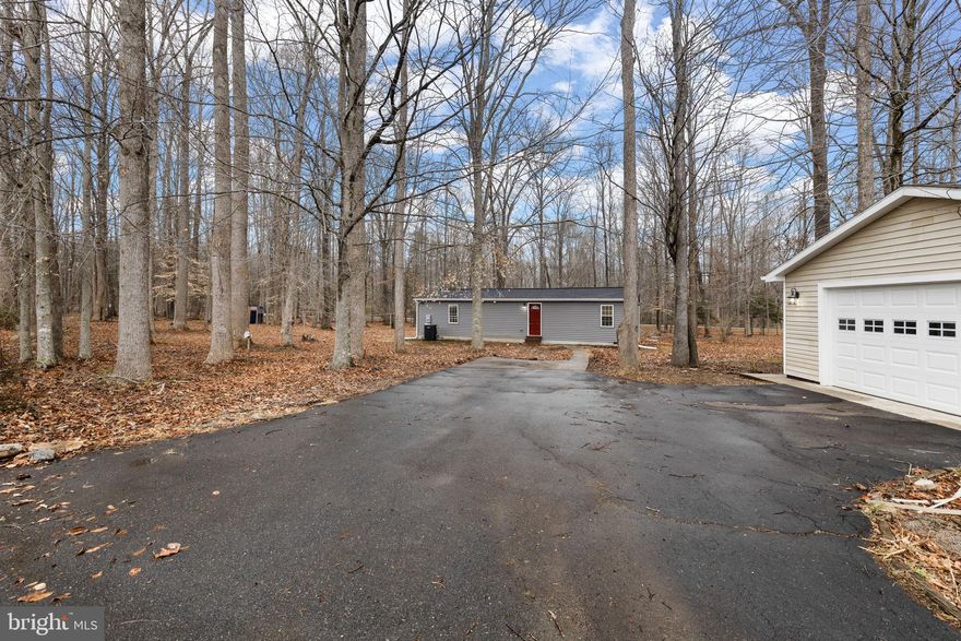 Experience the best of country living with a modern touch at 3125 Danbury Cir in Spotsylvania. Set on a flat and usable 5-acre lot, this beautifully updated 3-bedroom, 2-bath home offers the perfect combination of peaceful rural living and stylish interior improvements. From the moment you arrive, the paved asphalt driveway creates a clean, modern first impression while leading you into a private setting with plenty of room to spread out and enjoy.

Inside, the home has been thoughtfully renovated with today’s buyer in mind, featuring new siding, new windows, new HVAC, a fully updated kitchen with stainless steel appliances, new flooring, new cabinetry, updated trim, and refreshed finishes throughout. The result is a move-in ready home that feels fresh, functional, and inviting.

What truly sets this property apart is the incredible outdoor utility and flexibility. In addition to the home, you’ll find a large detached 2-car garage/workshop with its own separate electrical panel, making it ideal for mechanics, woodworking, storage, hobbies, or future project space. The property also includes 3 additional outbuildings, offering even more room for tools, equipment, creative workspace, or recreational use.

For those looking to embrace a more self-sufficient lifestyle, the property includes two chicken coops, giving you the opportunity to raise chickens and enjoy fresh eggs right at home. With wide open space, a level lot, and endless possibilities for outdoor enjoyment, gardening, hobby farming, or simply relaxing in a private setting, this property delivers the lifestyle many buyers are searching for but rarely find.

A rare opportunity to own a fully updated home with acreage, privacy, workshop space, and modern comfort—all in one exceptional Spotsylvania property.