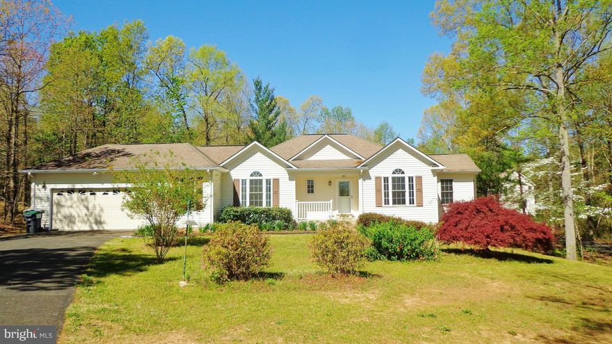 Nature Lovers & Gardeners Delight! This spacious move-in-ready rambler has so much curb appeal from every angle. From the moment you walk in the door you will notice how light & bright the rooms are, the beautiful tile & hardwoods, tray ceilings, and the serene park-like scenery through every window. Put on your gardening gloves and your sun hat and appreciate the lovely flora and peaceful lot.