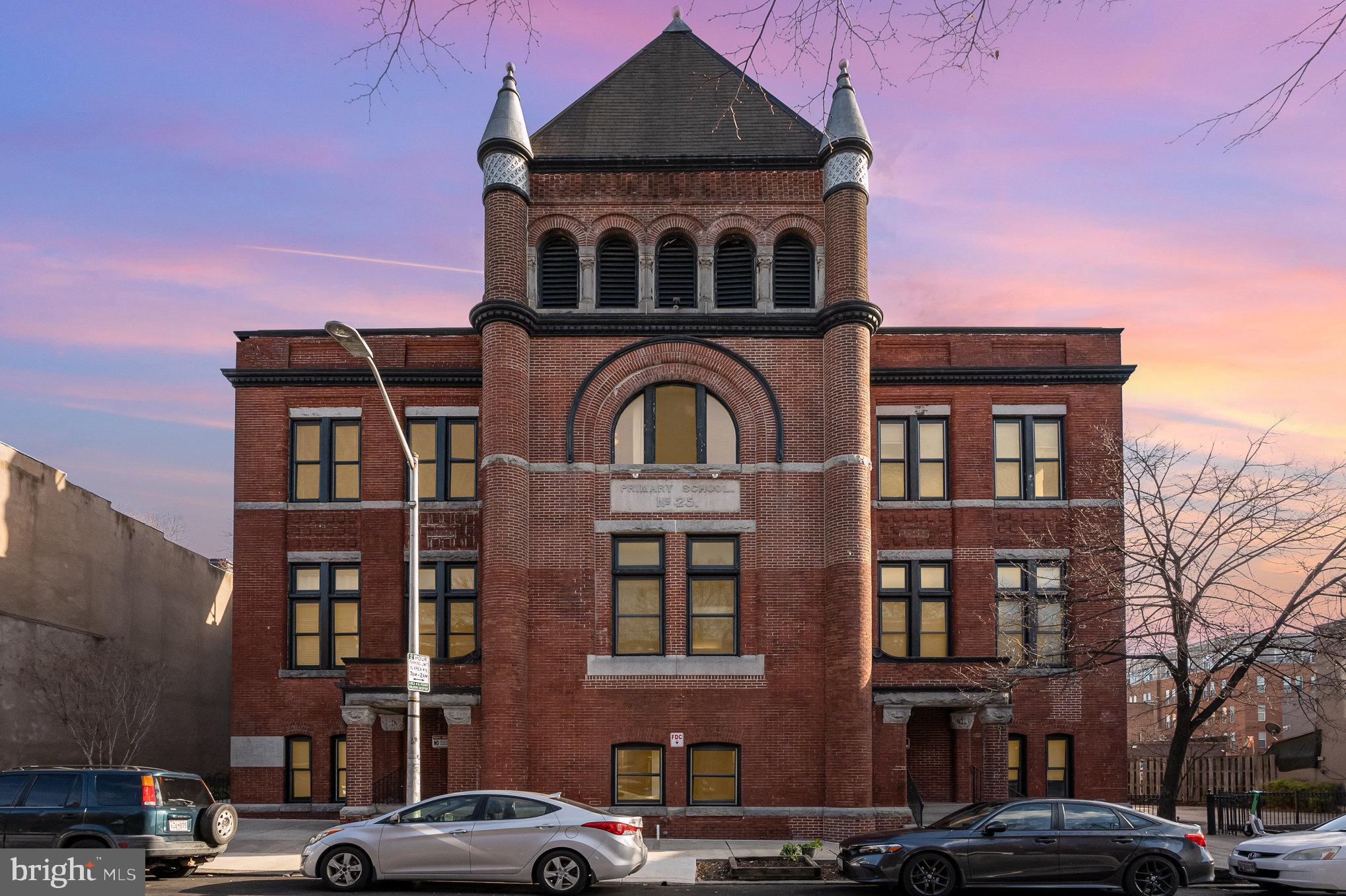 Most beautiful unit in a Baltimore landmark in the heart of Fells Point. Public school N 25 is a historic late Victorian brick structure with an imposing Romanesque tower. Unit 308 shares one of the iconic tower window, providing character and amazing views! This unit was totally remodeled in 2020, and offers a brand new stylish kitchen with stainless steel appliances, and an updated bathroom with new floor and wall tiles, toilet and vanity. The list of updates includes new paint throughout, new light fixtures, new fans, new door hardwares, new washer and dryer, new thermostat, new copper piping, new duct work and most importantly a brand new HVAC system! No neighbors above and no street noise! Hot location! Situated around the corner from Broadway Market, a couple of blocks to Harbor East attractions and from Fells Point waterfront. Worried about parking? No need to be, the 500 block of Bond St is permitted, and spots can also be rented at a local station for $150/month. Pets are allowed, and the fenced patios are ideal to walk your furry friends.