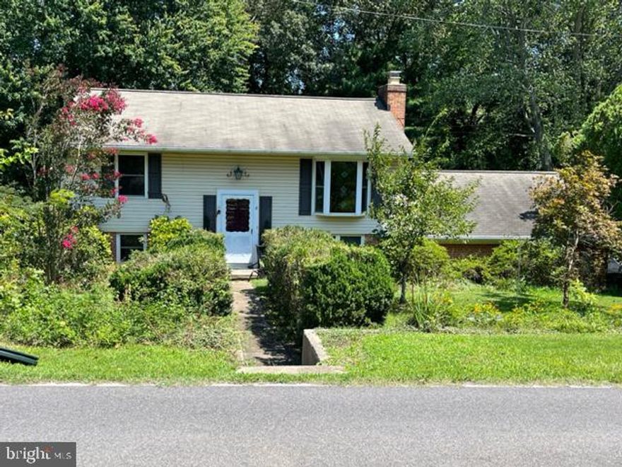 Do not miss out on this home with a superb in town location, easy access to the hospital, shopping, all the amenities of Laplata and close to route 301.  This home has been recently upgraded with vinyl siding, windows, HVAC and a hot water heater. The main level has 2 bedrooms and a full bath and  hardwood throughout except for the kitchen, there is a large living room that connects to the kitchen, The lower level boasts 2 additional bedrooms, a recently upgraded full bath and a large family room with a fireplace ( please note the fireplace has not been used in a long time ). The exterior of the home offers a wooded backyard for ultimate in city privacy, quite a bit of mature trees/shrubs. There is a large 2 car attached carport with built in storage. There is a nice level spot in the front of the yard right off the road that could be used as additional parking spaces which is common in the area.  One window in a basement bedroom was enclosed, that will have a new window installed by a licensed contractor.