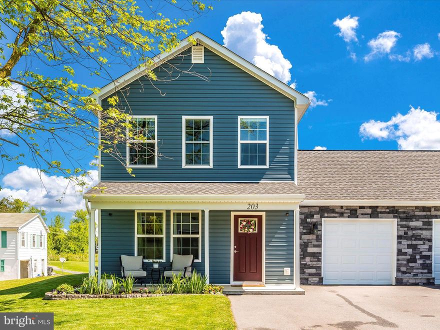 Let the breezy front porch and beautiful landscaping welcome you home to this well-maintained colonial-style duplex!  LVP flooring flows throughout the spacious living room and main level. The kitchen offers granite counter-tops, a butcher-block top island w/seating, upgraded soft close cabinetry, and stainless appliances.  The main level half bath also provides space for the washer and dryer which convey with the sale. The 1-car garage is finished too! The upper level provides a primary suite with bathroom, 2 additional bedrooms, and a 2nd full bath. The backyard offers a patio for grilling and raised garden beds with some vegetables and herbs already in place and room for more! This home was built in 2021 and boasts upgraded siding and 30-year architectural shingles. No HOA! Easy commute to I-81, Shepherdstown, and all amenities. It's a great home and won't last!