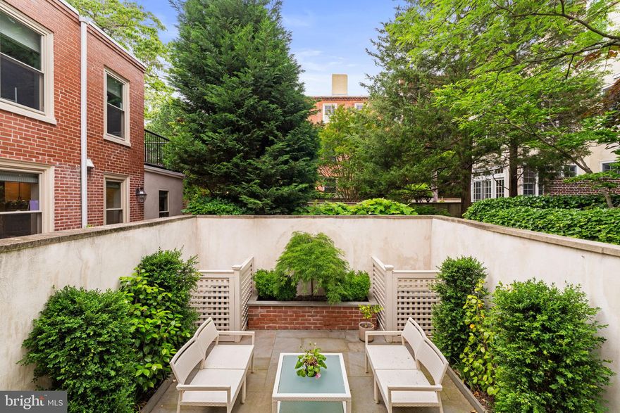 Exceptionally Rare, Light-Filled, Meticulously Restored 1813 Townhouse — 309 Spruce Street

No detail was overlooked in the complete renovation of this classic Society Hill townhouse. Rebuilt in 2022 to the highest standards with discerning craftsmanship and an uncompromising eye for quality, this residence seamlessly blends historic character with state-of-the-art design and modern amenities. Situated at the east end of a row of historic townhouses, the home boasts three light exposures, South, East, and North, further enhanced by 4 east facing windows added during its recent renovation. Every surface, system, and fixture has been thoughtfully upgraded with premium materials, down to the luxury hardware, bespoke lighting, and designer finishes throughout.

Set behind a handsome brick façade, the 1813 home features a landscaped slate courtyard and garden—a tranquil, private outdoor oasis that anchors the rear of the property and enhances the indoor/outdoor lifestyle.

Spanning four fully finished levels, the home offers five bedrooms, three full bathrooms and one half bath, with a flexible floor plan ideal for modern living and entertaining. The parlor level stuns with soaring 10’ ceilings, abundant natural light, and elegant proportions. A striking Valley Forge Pennsylvania blue marble mantle and surround was enhanced with a newly installed gas fireplace, and is the centerpiece of the grand living room. Adjacent to the living room is a conservatory/solarium, imported from the UK, currently used as a more formal dining area that opens directly onto the serene and private courtyard.

The chef’s kitchen is both functional and stylish, featuring a quartzite island and matching backsplash, coffee station/appliance garage, Sub-Zero refrigerator, Wolf range, Bosch dishwasher, custom designed and built cabinetry and solid brass finishes. In addition, there is a breakfast area and extra long banquette—all designed with custom built under-seat storage for maximum efficiency.

The second floor includes both media room/den as well as a luxurious primary suite. The den features soaring 10’ high ceilings, large south facing windows with working interior shutters, and custom built cabinetry with ample space for display and storage. The primary bedroom suite offers custom built-in wardrobes, and a spa-inspired en-suite marble bath with radiant heated floor, a windowed walk-in shower, custom built vanity, and Waterworks fixtures.

On the third and fourth floors, there are 4 additional bedrooms and 2 full bathrooms each fully renovated with custom cabinetry, marble counters and flooring, and the finest fixtures and finishes.

Additional highlights include completely refinished original heart pine and wide plank yellow pine flooring, all-new energy-efficient central HVAC and plumbing, built-in Sonos speakers, and upgraded electrical systems—ensuring modern comfort within a timeless framework. A stunning 5 flight staircase with original hand-carved bannister is another dramatic fully-restored detail of this exceptional and unique property.

Perfectly situated in the heart of historic Society Hill, 309 Spruce offers not only architectural integrity and refined interiors, but also walkability to the city’s beautiful squares, playgrounds, local parks, gourmet markets, cafés, and the city's best boutiques.
