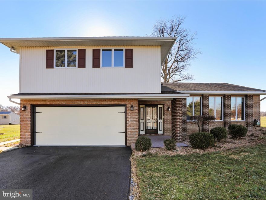 Situated slightly above road level on the .34 acre landscaped lot, this magnificent 2393 +/- sq. ft. split level home is awaiting your visit!  The main level entry features dark green slate flooring, large coat closet, a large living room with new rust carpet and handcrafted stairway railings, extremely large family room, half bathroom, laundry hallway, a pantry closet, a utility closet, interior access to the two bay garage, and beautiful french doors accessing the rear sun room with huge sliding glass windows for ventilation and rattan curtains for privacy along with a small electric heater.  Following the new rust carpet up the stairway is a hallway bathroom and two exceptionally large bedrooms off to the left, each having very large closets with double folding doors.  Continuing into the primary  bedroom are two separate and very large closets, large room of itself, and then a primary suite of a walk in closet, vanity with 3 mirrors, and separate shower with toilet.   The basement features a very large rec room with small TV bar and stools in one corner, new lighting, large unfinished storage room, furnace room, and another narrow room with the new sump pump.   Central air keeps you cool and the natural gas furnace keeps you warm:  both work perfect.   Out back are two sheds:  the yellow wooden one is ideal for your wood shop (fully lit and powered), and the brick shed houses your lawn and mower equipment (also fully lit and powered).  New driveway, soft washed roof, new paint, and perfectly operating appliances means you have nothing to worry about, just move in and enjoy!  1 Year Home Warranty Included.