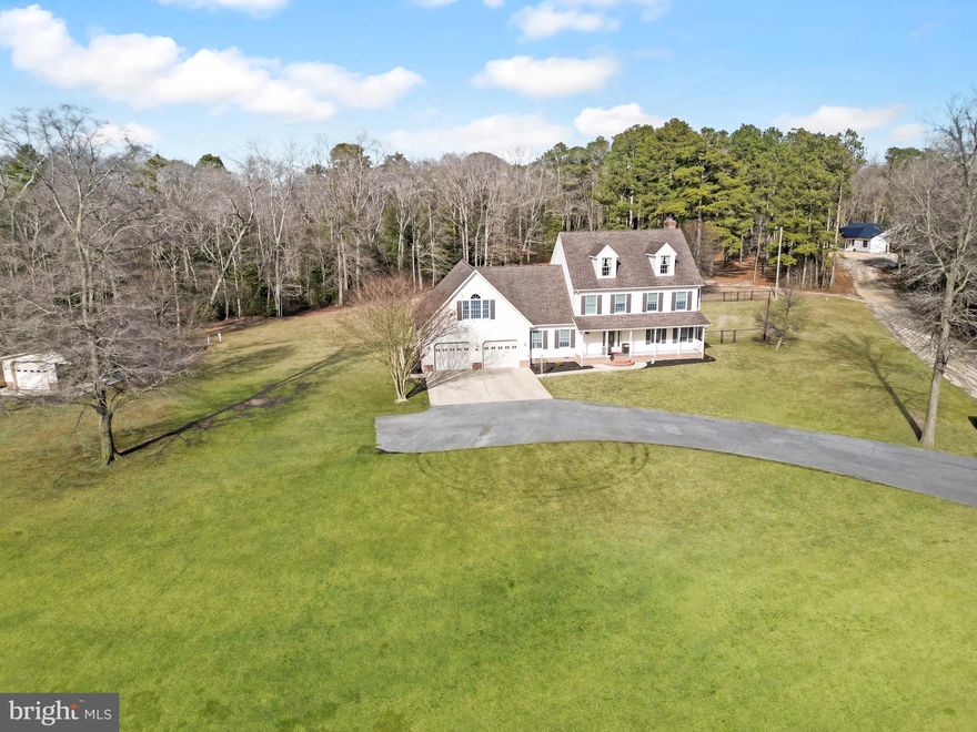 Situated on a spacious 3-acre lot in Delmar, DE, this well-appointed home offers 3 bedrooms, 2 full bathrooms, and 2 half bathrooms with plenty of room both inside and out. The home features a 2-car attached garage. Inside, you are welcomed by a large living room featuring a cozy fireplace, creating the perfect space for relaxing or entertaining. The expansive kitchen is designed for both function and gathering, offering a large center island, granite countertops, stainless steel appliances, and abundant cabinet space. Just off the kitchen is a formal dining room, ideal for hosting dinners and holidays. A half bathroom is conveniently located on the first floor for guests. Upstairs, the spacious primary suite includes a walk-in closet and a private bathroom featuring a walk-in shower and soaking tub. Two additional bedrooms share a full hallway bathroom. The second floor also features a large bonus room, offering flexible space for a media room, playroom, home office, or guest area, along with an additional half bathroom. The bonus room also has separate exterior access, providing unique possibilities for a private workspace or hobby area. Outside, the property continues to impress with a partially fenced backyard and outbuilding, perfect for storage, a workshop, or equipment. With acreage and functional living space this Delmar property offers the perfect blend of comfort, privacy, and flexibility.