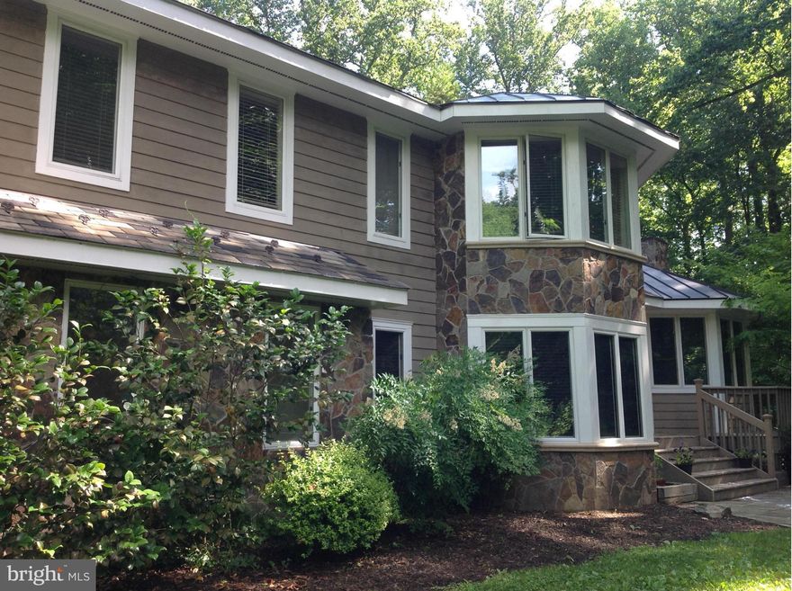 Cedar & stone contemporary on four wooded acres. Water access rights to the Severn River. Walking distance to the B&A trail. Convenient to Baltimore, DC, and Annapolis. Cathedral ceilings, hardwood floors, stainless steel appliances, finished basement, hot tub, wraparound deck, two car garage. Top rated Severna Park school district. Short term leases acceptable.