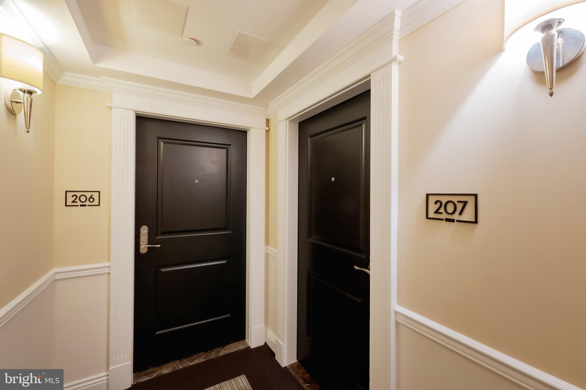 Rare corner unit offering total privacy and exceptional natural light in Bethesda’s premier luxury building, Hampden Row. Recognized as the #1 Best New Luxury Condominium by Bethesda Magazine in 2017, this Toll Brothers development delivers exceptional quality, privacy, and design far beyond typical rental options. The residence features oversized windows, soaring 9-foot ceilings, and 5-inch-wide plank hardwood flooring. The carefully crafted layout flows beautifully from room to room, enhanced by custom white cabinetry and premium finishes. The kitchen is outfitted with quartz countertops, Grohe fixtures, and high-performance appliances by Gaggenau, Thermador, and Bosch.
Perfect for those looking for a pied-à -terre, downsizers, or anyone seeking low-maintenance luxury, this residence is both refined and livable. This light-drenched home also includes access to extraordinary amenities: three luxurious lounge areas, two rooftop terraces—one for relaxing with phenomenal views and the other ideal for entertaining—a rooftop gym with skyline views, and a 24/7 concierge. The building also features a beautiful mailroom and a secure garage with easy access, suitable for a luxury sports car. Located in the calm and quiet Golden Triangle, just one block from Bethesda Row and top restaurants like Mon Ami Gabi and Aventino Cucina. Most units in the building are owner-occupied, offering a more refined, peaceful lifestyle.