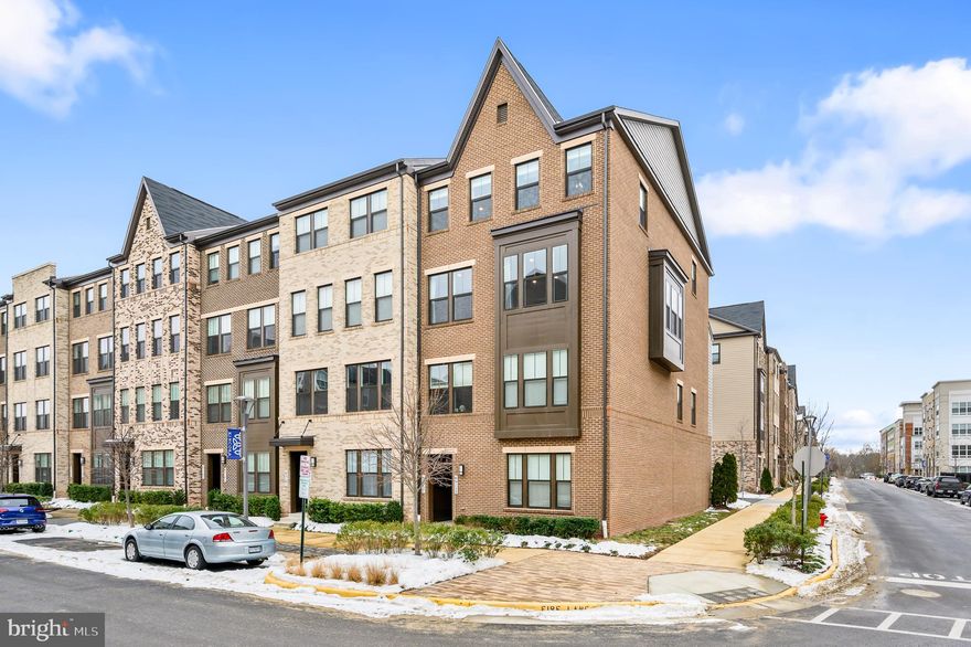 ***PRICE IMPROVEMENT*** Modern and light filled end-unit SMART home in the heart of the desirable Kincora community! This 2,604 sq ft Bluemont model with 3 bedrooms, 2.5 bathrooms and a 1 car garage was built in 2020 and features $39k of upgrades, including: refrigerator with built-in Keurig | all carpeting was replaced with Mohawk, SmartStrand “Forever Clean" carpets over top-grade padding | custom under stairs storage | custom laundry room cabinets and storage | storage shelves in garage | wet bar with beverage fridge and shelving | wood accent wall | industrial light fixtures | barn doors | wide plank luxury vinyl plank flooring | crown molding | tray ceiling.  The kitchen is the heart of the open plan main level.  Gather around the large island in the gorgeous gourmet kitchen with GE Profile appliances, quartz countertops and soft close cabinets or relax in front of the linear gas fireplace with stone surround.  The balcony is perfect for a morning coffee.  Upstairs you will find 3 bedrooms, a convenient laundry room and 2 bathrooms.  The primary suite features  a large walk-in closet, barn doors, tray ceiling, and a spa like bathroom with frameless glass walk-in shower and double vanity.  This property is a SMART home. The GE Kitchen Appliances, GE Laundry Appliances, Schlage Front Door Lock, Resideo Garage Door, Leviton Smart Switches (Lights), Ring Door Bell are all attached to a professional grade Ruckus Managed POE Switched Network with two Wireless Access Points (AP) which are remote managed through Apple or Android devices and are all compatible with Alexa or Google Home for automation. Bring your EV and your charger, the garage has a dedicated 240V outlet ready for your at-home charging station!  Inspired and powered by nature, Kincora offers a one-of-a-kind, interactive community that works in harmony with our beautiful surrounding environment. Explore the winding trails that follow the flowing waters of the Broad Run tributary, enjoy a picnic in lush, growing green spaces or just admire the area’s great blue herons. With 165 acres of hiking trails and preserved, untouched landscape, no other community surrounds you with so much natural beauty.  This address feeds to Loudoun County Public Schools.  Easy access to main roads, shopping, dining, sports, entertainment, the Dulles International Airport, and so much more!