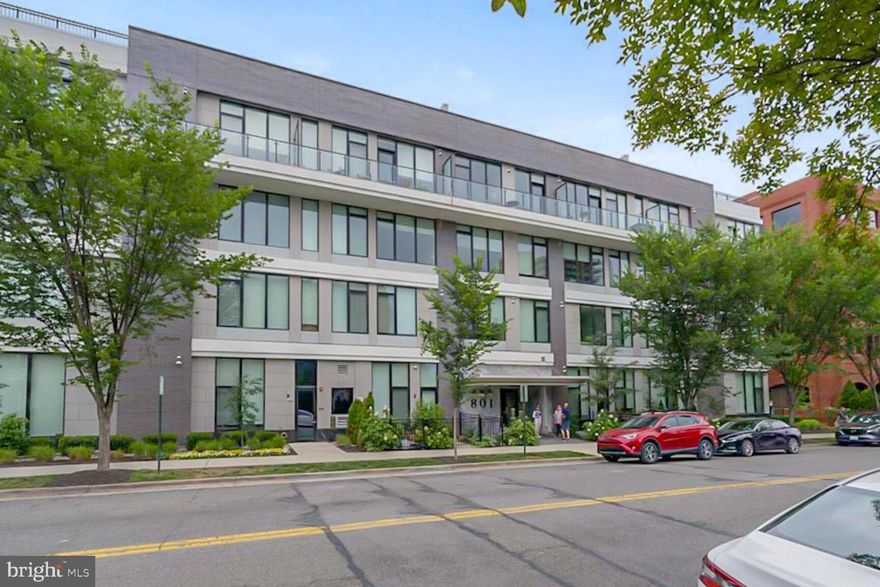 Welcome to Unit 409 at 801 North — a stunning top-floor 2-bedroom + den condo in a boutique building in the heart of Old Town’s vibrant Arts District. This spectacular residence features breathtaking panoramic views of the Potomac River through dramatic floor-to-ceiling Pella windows. Thoughtfully designed with luxury finishes and attention to detail, the home includes keyless entry,10-foot ceilings, 7-inch wide plank flooring throughout, Caesarstone quartz countertops, sleek Europa cabinetry, Bosch appliances, full-size washer and dryer, frameless glass shower enclosures and large-format tile with limestone accent walls in bathrooms.
The flexible and inviting layout features a spacious formal entry, a versatile den ideal for a home office, and a smart split-bedroom configuration. The private owner's suite includes a generous walk-in closet and a spa-inspired en suite bath. An expansive balcony, accessible from both the living area and second bedroom, offers an incredible outdoor retreat with sweeping east facing river views — perfect for enjoying the sunrise or an afternoon break .
801 North is a pet-friendly building with premium amenities, including a spectacular rooftop terrace with panoramic views, a stylish residents' lounge, secure garage parking with two assigned spaces, and bike storage. Additional personal storage is conveniently located on the same floor as the unit.
Enjoy car free living in this walker's paradise with parks, tennis courts, bike trails, weekly farmers’ market (right across the street), and a rich variety of restaurants and shops close by.  When life takes you further, easy access to major commuter routes makes getting to DC, the airport and around Northern Virginia a breeze. Don’t miss your opportunity to call this exceptional residence home.