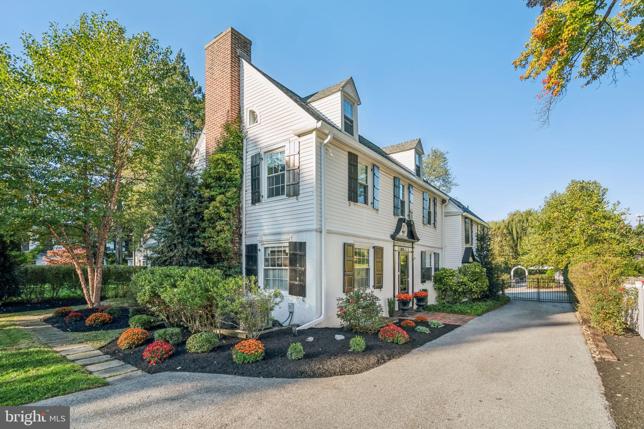 Enjoy wonderful updates and inviting indoor-outdoor living in this meticulously maintained and thoughtfully improved New England-style home that is just a short walk from the Strafford train station. Offering four bedrooms and three-and-a-half bathrooms, this charming abode combines modern convenience within the Tredyffrin-Easttown School District. Sunny interiors welcome you inside to discover hardwood floors and handsome millwork. Relax in the expansive living room featuring a stately wood burning fireplace, beautiful built-in cabinetry, shutters, recessed lighting, and lovely sconces. The spacious dining room welcomes family gatherings and lovely backyard views. Move into you large family room where many memories are waiting to be created. Step down into the adjacent gourmet kitchen and you will enjoy heated floors, marble countertops, a custom painted tile backsplash, a massive island/breakfast bar and a farm sink. Upscale stainless-steel appliances include a refrigerator, dishwasher, beverage center, built-in microwave, and a vented gas range with double ovens. Bright bedrooms provide lavish accommodations with great closets, windows, charming nooks, and built-ins alongside two completely renovated bathrooms. To add to the charming space is a renovated third floor space perfect for an office or additional bedroom with ensuite
full bath. Outdoors, a beautiful oasis for gardening, relaxing or entertaining awaits the next homeowner. Alongside a stone wall with LED lighting, the sparkling swimming pool features a newer liner and a stamped concrete pool deck, both added in 2018. The flagstone patio invites al fresco dining, and the large lawn provides plenty of space for romping and games. In the pool shed, you will find a Proslat wall system, workbench, overhead storage and a beverage refrigerator to keep refreshments close at hand. This exceptional residence features 200-amp electrical, a security system, three-zone gas heat, two-zone central air, and a 2018 water heater. A whole house generator was added in 2020. The long, wide driveway leads to a detached two-car garage built in 2017. Inside, there is plenty of parking and excellent storage thanks to the Proslat wall system with hooks, shelves and baskets. And to top it off a new roof was added in 2024. Additional storage is accessible via pull-down steps to the garage attic area. The oversized front yard and charming, freshly repainted façade add magnetic curb appeal to this special home. From this convenient location, you are close to downtown Wayne, wonderful restaurants, numerous golf courses, parks and major highways.