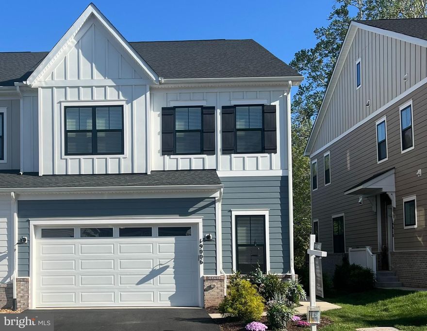 Welcome to this exceptional 2023-built townhome in the sought-after Cadence at Lansdowne, a premier 55+ community. This is the first resale of this rarely available floor plan with THREE FINISHED LEVELS, offering a thoughtfully designed layout with two primary suites—one on the main level and one on the upper level and an impressive array of upgrades and custom finishes throughout. The flexible layout provides multiple private living areas, offering an ideal solution for multi-generational living, guests, or evolving lifestyle needs.” The main level features a stunning gourmet kitchen with stainless steel appliances, custom backsplash and countertops. The kitchen opens to the great room, creating the perfect space for both everyday living and entertaining. The soaring 10 foot ceilings enhance this main level living. The spacious main-level primary suite includes a luxurious bathroom with custom top of the line tile. The design of the home provides the convenience of true main-level living. Additional highlights include a laundry room with custom cabinets, powder room, and direct access to the finished two-car garage with insulated garage door. As an end unit, the home is filled with natural light thanks to additional side windows. Step outside to the beautiful deck overlooking a peaceful wooded setting and creek, offering privacy and tranquil views. Upgraded hardwood floors on main and upper level as well as beautiful wood staircases. Upstairs, you’ll find a second expansive primary suite with a sitting room and luxury bathroom with custom features. The upper level also includes another generously sized bedroom with its own private bathroom, a spacious and comfortable family room and a versatile bonus room perfect for an office, hobby space, or additional living area. The finished walk-out lower level adds even more living space and features a large recreation room with custom wall details, a full kitchenette/bar area with upgraded cabinets and countertops, exercise room, storage area and a full bathroom with custom tile. Walk out to the large fenced backyard, perfect for relaxing or entertaining. Located close to shopping, major commuter routes, wineries, and breweries, this beautifully upgraded home offers the perfect blend of luxury, comfort, and convenience in one of Loudoun County’s most desirable active adult communities.Residents can enjoy scenic walking trails throughout the neighborhood, a nearby dog park and convenient access to pickleball courts. The home is ideally located close to shops, restaurants, and just minutes from INOVA Loudoun Hospital and a variety of medical offices. Easy access to Route 7, Route 28, The Greenway and the Dulles Toll Road. The community includes front yard and common area maintenance, making for an easy, low-maintenance lifestyle. This nearly new home offers a perfect blend of modern design, energy efficiency, smart home features, and a prime location in one of Loudoun County’s most sought-after communities. Pickleball courts, dog park and miles of walking trails.
