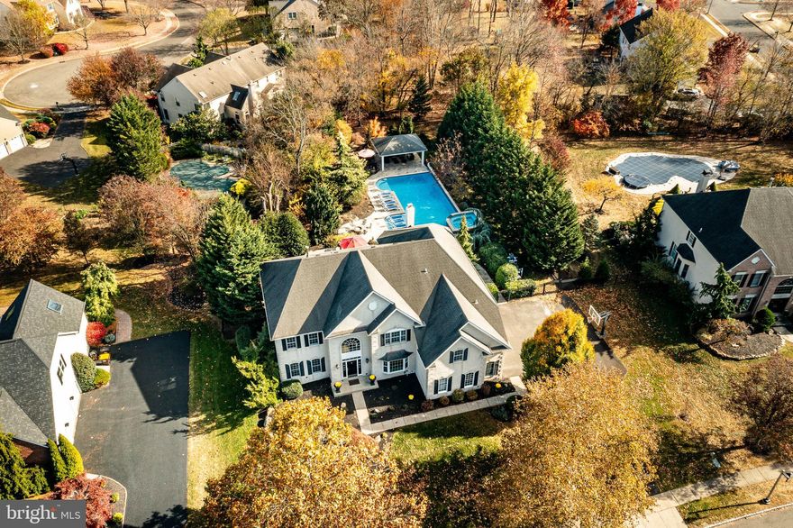 Exquisite Colonial Elegance in Montgomery Township - 124 Annabel, North Wales, PA
Welcome to 124 Annabel, a sophisticated colonial masterpiece embodying refined living in Montgomery Township's heart. This stunning residence offers over 4,700 square feet of meticulously designed living space and is conveniently located near major routes, shopping destinations, and esteemed educational institutions.

Upon entering this elegant home, you are greeted by a foyer adorned with marble floors and soaring ceilings with triple crown moldings, setting the tone for the exquisite details throughout the house. Freshly painted interiors, luxurious new carpeting, and gleaming hardwood floors create a sophisticated ambiance that flows seamlessly from room to room. The convenient office off the foyer provides many uses; with lots of natural light, you will find the perfect workplace spot. The foyer will also lead you to the peaceful zen of the living room with distressed wood floors and lead you into the formal dining area to entertain all of your guests. The grand family room off the kitchen features a breathtaking two-story ceiling and a magnificent stone fireplace, perfect for intimate gatherings or grand celebrations.

The home's centerpiece is a recently remodeled kitchen that will delight even the most discerning chef. This culinary haven is as functional as it is stylish, featuring abundant white cabinetry, sumptuous quartz countertops, and a beautifully intricate backsplash. An expansive island adorned with stunning pendant lights invites effortless entertaining and socializing. Whether you are making a gourmet meal and utilizing the double ovens and the gas cooktop or enjoying a simple wine tasting around this magnificent island, you will be assured you will have room to spare. 

Step outside to discover an enchanting outdoor sanctuary meticulously designed for exquisite entertaining year-round. The lavish cooking area with a built-in grill and granite bar with seating provides an idyllic space for hosting summer cookouts. Adjacent to the travertine deck is the stunning in-ground pool and spa. Here, you can lounge on the swim deck in your recliner with two fountains that will keep you cool while you enjoy the sunshine. Or lounge in the pool's deep end with a cozy area for you to sit and chat near the pergola. You'll find a cozy fire pit, perfect for gathering on cool evenings. The exquisite pergola adds a layer of charm, offering a serene vantage point overlooking the spectacular pool and beautifully landscaped yard.

The fully finished basement is a masterpiece of entertainment, showcasing a stylish bar, a dedicated movie area, and a convenient half bath. It is the perfect venue for hosting gatherings, where lifelong memories will be created over cocktails and spirited game-day celebrations.

Ascend the elegant staircase to the second floor, where you'll find the sumptuous primary suite. This spacious retreat features tray ceilings,  a serene sitting area, and a vast walk-in closet, providing ample space for your treasured belongings. The attached sitting room and ensuite bathroom are a sanctuary of relaxation, with a lavish soaking tub, an indulgent shower, and exquisite finishes designed to wash away the day's cares.

This remarkable residence is not just a home—it's a lifestyle of elegance, sophistication, and unparalleled comfort. Schedule your private showing today and experience the luxury of life at 124 Annabel, where your dreams of refined living can become a delightful reality.