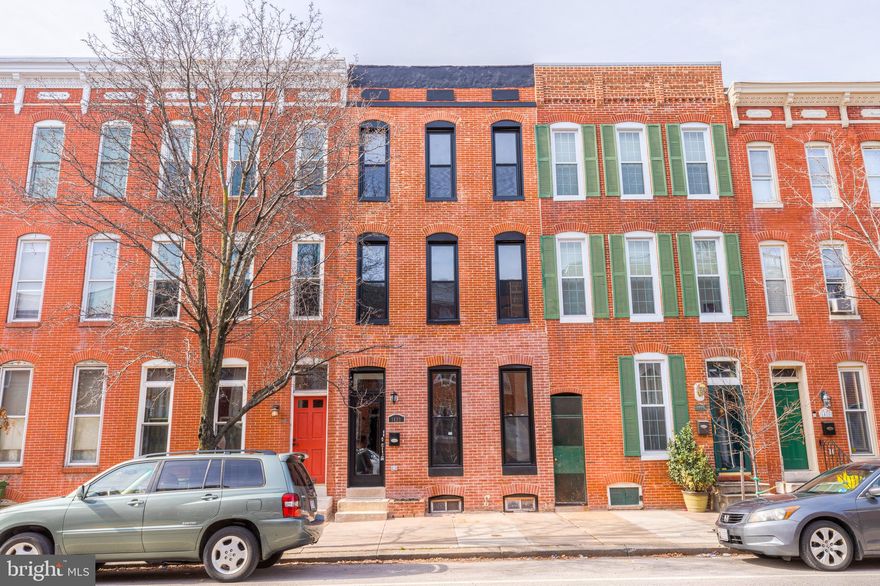 If you missed out the first time - now may be your second chance!  (pending release due to buyers financing).    This amazing home and income producing property (all in one)  could be yours after all.   Easy to show, or check out our interactive "Walkthrough" virtual tour.    You'll love this fully renovated 3 bed, 3 bath 2-unit rowhome with parking pad and about 2300 sf of living space.  Almost everything is brand new - just move in and enjoy! While you live in the 'Owners Unit', you can make the downstairs apartment your own income generating ATM machine. (2 bed, 2 bath 'Owners Unit' is top 2 floors and 1 bed, 1 bath apartment is on 1st floor - separate entrances and meters). Potential to generate about $15,000 (or more) a year - while living here. Rent out the apartment to a full time tenant, Or use the apartment as your own space . .. and do short term rentals when you need some extra cash. The 'Owners unit' kitchen (2nd floor) is the centerpiece of this magnificent home. It is as functional as it is beautiful. You'll love the Calacutta Classique Quartz counters with a 10 ft long breakfast bar - which offers an easy transition to the living room with exposed brick wall and matching Quartz mantel) - and ends in a delightful quartz 'waterfall'. The counters contrast beautifully with the dark gray 'quiet-close' cabinets, white subway tile backsplash, and stainless steel appliances. To complete the modern-rustic design of the kitchen/living room are the Baltic Birch Hardwood floors, the 60" Aged Gray Wood Blade ceiling fan, the Black Steel Geometric Pendant lights and more eye-catching finishings. On the top floor, you'll find the master bedroom suite w/vaulted ceiling and walk-in closet - sprinkled with cool & modern touches. Master suite also boasts a fully renovated master bathroom that will make you feel like you're on permanent vacation. Custom designed shower with porcelain marble surround, mosaic tile inset soap/shampoo holder, built-in bench, sliding glass shower door, and multi spray shower head. To complete the hotel-like bathroom is a 60 inch vanity with dual sinks, 'silver cloud' granite counters, touch-light mirrors, & dazzling chrome finishings/fixtures. The other 2 bathrooms and Apartment kitchen are also fully renovated with ceramic, granite, etc in all the right places. Also brand new: BOTH Central HVAC systems; most the windows (19 brand new out of 21); both electric panels/systems, both HWHs and plumbing throughout; 400 sf concrete parking pad/walkway; deck; and more (see list of all renovations in Documents section). All this plus a great location in the heart of Federal Hill. You will you be proud to call this your home - AND - with all the renovations, rental income possibilities, and the new homes across the street STARTING at $650,000 - you can also be confident you're making a wise investment for many years to come.