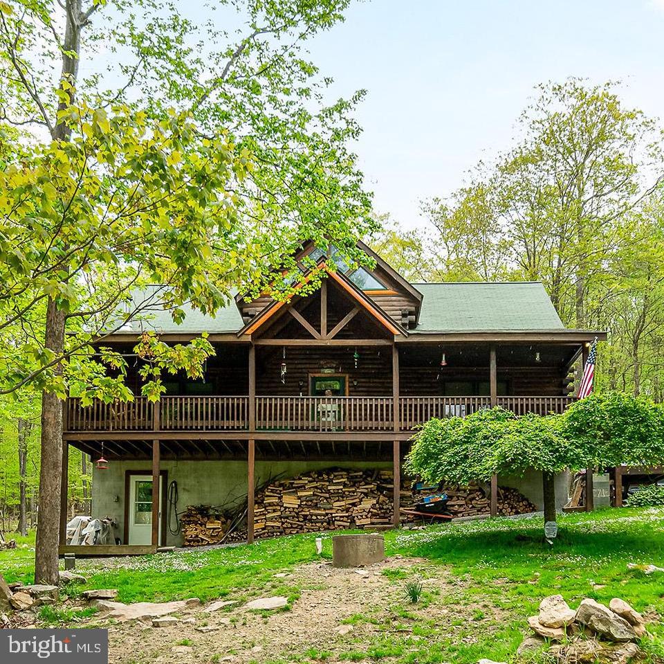3BR, 2.5BA, 2100+ sf cabin in the woods with woodstove! Enjoy nearly 13 acres of peaceful, wooded seclusion in an ultra private setting. Setup for one-level living with a master suite & laundry on the first floor. Upstairs, 2 spacious bedrooms and additional bathroom. Full unfinished basement offers an additional 1400sf and plenty of storage. Sit for hours on the front porch and soak in the sounds of the birds & nature. ATV friendly. Lake / town each less than 10 minutes away. Partially furnished.
