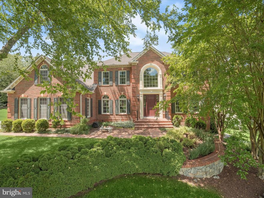 Located in the desired Saint Stephens Estates community, you can experience the epitome of luxury in this sun-filled home featuring an open floor plan and a soaring 2-story foyer, showcasing hardwood flooring and triple crown moulding. The gourmet kitchen is a chef’s delight, boasting an oversized entertainer’s island breakfast bar, rich wood cabinetry, a travertine tile backsplash, and granite countertops. Enjoy meals in the cozy breakfast room, while the formal living and dining rooms highlight elegant accent molding and architectural columns.  The entry level includes a home office, powder room, and laundry/mud room for added convenience. Retreat to the spacious primary bedroom suite, complete with a high cathedral ceiling, hardwood flooring, a sitting room, two walk-in closets, and a vanity area. The remodeled luxury bath features a soaking tub, frameless shower, and Cambria quartz dual vanity. The upper level also offers a second bedroom with an en suite full bath and two additional bedrooms adjoined by a dual entry full bath.  The lower level is designed for entertaining and relaxation, with a recreation room, a full kitchen, exercise room, flex room, full bath with barrier-free, walk-in shower, abundant storage room, and walkout access to the patio. Nestled on nearly 1 acre of beautifully landscaped grounds, this home boasts a bi-level deck with a retractable awning, offering picturesque views and the perfect space for outdoor enjoyment. Convenient access to major highways, multiple grocers, shopping, and eateries. This home combines luxury, comfort, and convenience in a picturesque setting.