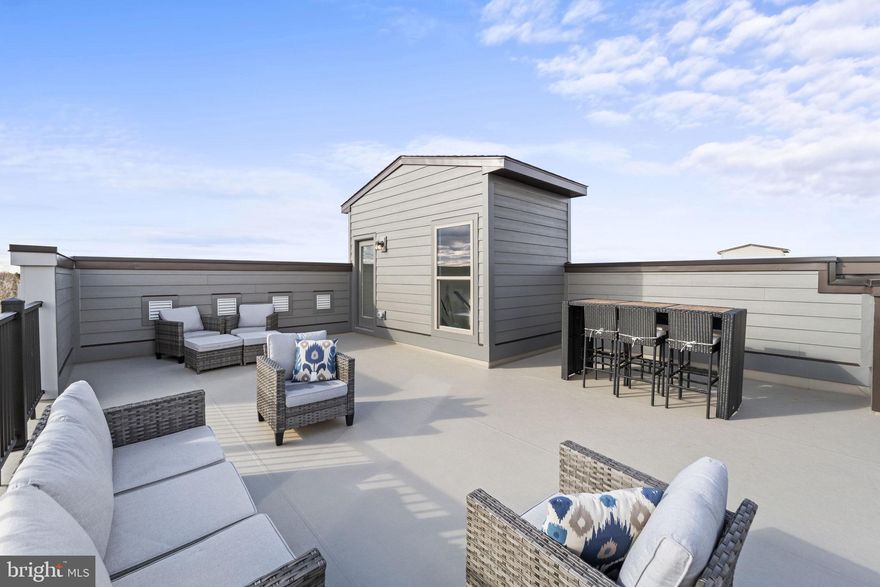 Brand new Stanley Martin townhome-style condo with rooftop terrace and walking distance to the Silver Line Metro!
Welcome to the Overlook at Dulles Tech! This Julianne townhome-style condo offers all the best amenities and upgrades for a lifestyle. With over 2,500 square feet of living space, this three-bed, two-and-a-half-bath home is perfect for entertaining family and friends. The main level has plenty to offer with a kitchen featuring stainless steel appliances and granite countertops, a dining area, a powder room, a family room with a fireplace, and a covered balcony overlooking beautiful views of the neighborhood. Upstairs are the bedrooms including a large primary bedroom with an en suite bathroom as well as two additional bedrooms sharing a hall bathroom. But wait there's more! For those looking to enjoy outdoor views in peace and quiet, head up to the spacious rooftop terrace where you can relax after a long day or host guests during warm summer evenings. Make this stunning condo your home today by taking advantage of all that it has to offer: easy access to commute routes into DC; nearby shopping centers and great schools! The photos shown are from a similar home.  Contact us to schedule a tour or stop by and visit our model homes today!