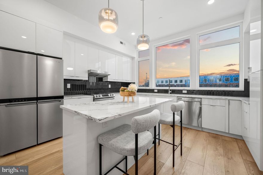 For a limited time the Builder is offering a 1% credit towards a rate buydown, assist, or the upgrades of your choice. Discover modern city living in Somerset Square, a vibrant new community featuring 23 townhomes and 52 stacked duplexes, perfectly situated just two blocks from Fishtown and two blocks to Aramingo Ave. With rapid development transforming the area, now is the time to invest in this thriving neighborhood. Buyers have options for finishes and upgrades to customize to their tastes and they can choose between dark or light colored cabinets. This exquisite lower level condo is designed for modern living, featuring a rear-loading garage with 1 car parking. The main floor features a chef’s kitchen completed with quartz countertops, stainless steel appliances, and a large island for entertaining, a spacious living and dining area and a half bath. The oversized windows allow maximum natural light in, and the large sliding doors lead to your private balcony. Upstairs includes three bedrooms, and a guest hall bathroom. The primary suite has a luxurious en-suite bath and ample closet space. Additional features include Nest thermoset,  video Intercom system, plus extra storage in the shared basement. This community will have low HOA fees & condo fees that cover snow removal & landscaping and common areas,10 year tax abatement and 1 year builders warranty. Ask me how you can save an additional $1,525 in lender credits buy using our preferred lender!