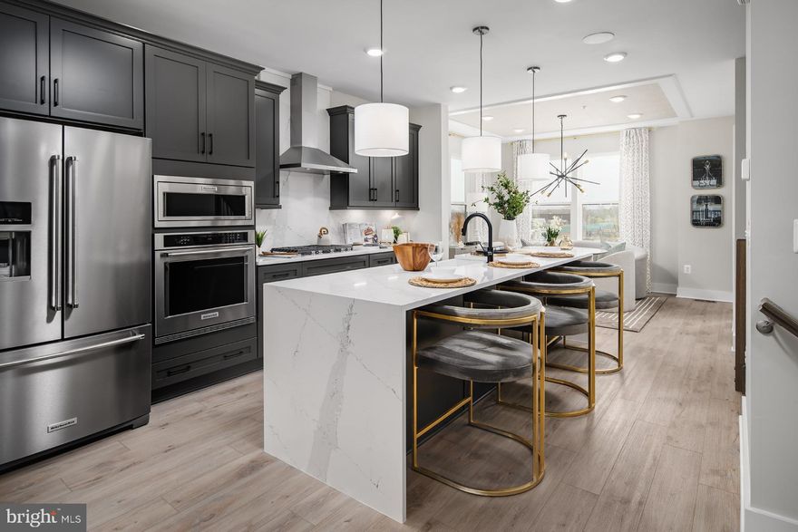 Welcome to the Rockland, an open-concept luxury townhome with modern finishes and an urban aesthetic! Enter the home through the main entryway or the rear load 2-car garage, both leading into a spacious recreation room that can be converted into an enclosed bedroom or study and full bathroom. Ascending to the second level, you will discover the main living space comprised of a sunlit family room, a generously sized kitchen, and a dining room complete with a sliding glass door and rear deck access. With an oversized island and optional gourmet kitchen upgrade, this space is truly chef worthy. When it's time to relax, retreat to the primary suite, a private getaway that can be found on the third level of the townhome. With an optional dropped tray ceiling and large walk-in closet, this suite is the perfect place to unwind. The spa-like bathroom features dual vanity sinks and a seated shower. What's more? For ultimate relaxation, you can upgrade to a roman shower with dual shower heads or a soaking tub. The laundry room is also located on the third level, conveniently accessible from the primary suite and secondary bedrooms. Enjoy stunning views from the fourth level's loft deck, a private outdoor living area perfect for entertaining family, friends, and loved ones. Flexible by design, the fourth level offers an optional secondary bedroom and full bathroom or second primary suite with open entertaining, recreation, or flex space, and ample storage closets. With countless opportunities to customize, the Rockland has something for everyone. ***THIS PROPERTY MAY QUALIFY FOR THE BROWNFIELD TAX CREDIT. WHICH COULD RESULT IN UP TO A 70% REDUCTION IN ANNUAL CITY PROPERTY TAXES FOR TEN YEARS***  See sales consultant for more information. *Photos may not be of actual home. Photos may be of similar home/floorplan if home is under construction or if this is a base price listing.