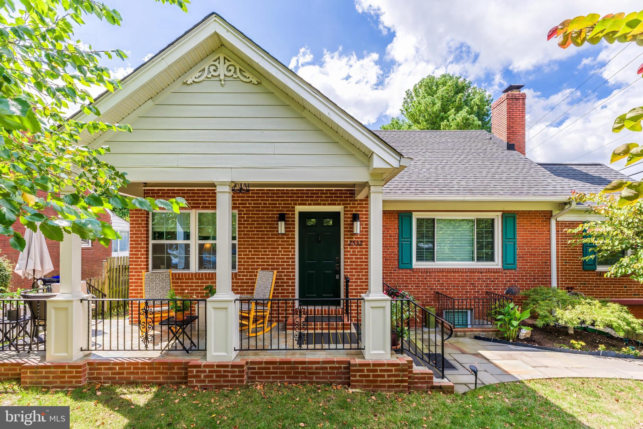 Incredible value! Welcome to this beautifully maintained and spacious Cape offering 2,865 total square feet of thoughtfully updated living space. Nestled behind a classic white picket fence and surrounded by lush, mature landscaping on a fantastic corner lot, this 4-bedroom, 3.5-bath home effortlessly blends timeless charm with modern convenience. The front porch, added in 2019, invites you to relax and enjoy the peaceful, tree-lined setting. Inside, you'll find gorgeous hardwood floors, updated bathrooms throughout, and a stunning kitchen renovation completed in 2019. The main level features a bedroom with a full bath, a generous family room with a wood-burning fireplace and built-in bookcases, and a bright sunroom—perfect as a home office or reading nook. The expanded dining room is ready to host family gatherings and special occasions, while the beautifully renovated kitchen is a chef’s dream. Abundant cabinetry and counter space provide plenty of room for cooking and appliances. Enjoy casual meals in the breakfast nook while watching your favorite show on the kitchen TV.  Beautiful glass tiles highlight the backsplash and round out this charming kitchen.
Upstairs, the spacious primary suite includes large closets and easily accessible storage area running the width of the room. An additional bedroom with built-ins and a stylishly updated bathroom complete the upper level. The lower level offers incredible flexibility with a private bedroom, full bath, and dedicated office space featuring a separate foyer entrance—ideal for a home business or guest suite. Additional highlights include new windows (2014), a new roof (2020), an expansive driveway with a basketball hoop, and storage galore throughout the home.
Step out back to your private patio oasis, perfect for entertaining or relaxing in a serene garden setting. Located just minutes from DC, and only 1.5 miles to the Ballston Metro and 1 mile to I-66, this home is a commuter’s dream. Zoned to top-rated schools—Discovery Elementary, Williamsburg Middle, and Yorktown High—and within walking distance to Lee Heights Shopping Center, this property provides a rare opportunity to enjoy suburban tranquility with unbeatable urban convenience. This hidden gem truly has it all.