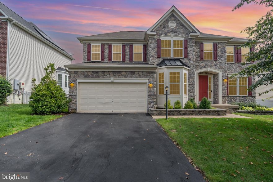 Welcome to 16343 Boatswain Circle, a stunning three-level colonial offering over 4,200 square feet of finished living space and nearly 5,000 square feet total, nestled in one of Woodbridge’s most sought-after communities. Designed with elegance and function in mind, this home features a grand split staircase, hardwood floors throughout the main and upper levels, and high-end finishes that make every space feel refined and inviting.

At the heart of the main level is a spacious family room with a cozy gas fireplace, seamlessly connected to the gourmet kitchen. The kitchen is a chef’s dream, offering granite countertops, an oversized eat-in island, stainless steel appliances, a gas cooktop, double wall ovens, pantry, and recessed lighting. Just off the kitchen is a sunlit breakfast area large enough to seat eight, with peaceful views of the lush backyard—an ideal space that also works well as a main dining area.

Beyond the main living spaces, the first floor also features a private office, a formal living room, and a traditional dining room with elegant wainscoting (currently used as a second office), along with a powder room and access to the attached two-car garage.

Upstairs, the expansive primary suite is a true retreat, complete with a three-sided fireplace, sitting area, and a large walk-in closet with a custom closet system. The en-suite bath features dual vanities, a water closet, separate shower, and a corner soaking tub with views of the backyard. Three additional generously sized bedrooms offer flexibility, with two featuring built-in closet system organizers. A large hall bathroom with double vanities and a convenient upper-level laundry room round out the space. Hardwood floors were installed on this level to extend the elegance and cohesion of the home’s design. The open hallway overlooks the dramatic two-story foyer below.

The lower level is perfect for entertaining or multi-generational living, featuring a custom bar area, a large recreation room, a spacious fifth bedroom (currently used as a gym), an additional flex room, a third full bathroom, and a utility room with storage space. The basement also includes upgraded flooring in all rooms except the storage area and basement stairwell.

Outside, enjoy a backyard oasis with a custom-built stamped concrete patio, built-in grill station, lush landscaping, and a built-in sprinkler system to keep everything green and thriving. Additional features include central vacuum, modern fixtures throughout, ceiling fans in all bedrooms as well as the office, family room, and breakfast area, and an HVAC system updated in 2024.

Located in the amenity-rich Port Potomac community, residents enjoy access to indoor and outdoor pools, a clubhouse, fitness center, dog park, playgrounds, two tennis courts, basketball courts, and more—all just minutes from I-95, Potomac Mills, Stonebridge at Potomac Town Center, and major commuter routes. Don’t miss this rare opportunity to own a truly exceptional home in a prime location—schedule your private showing today. Seller is open to and reviewing backup offers.